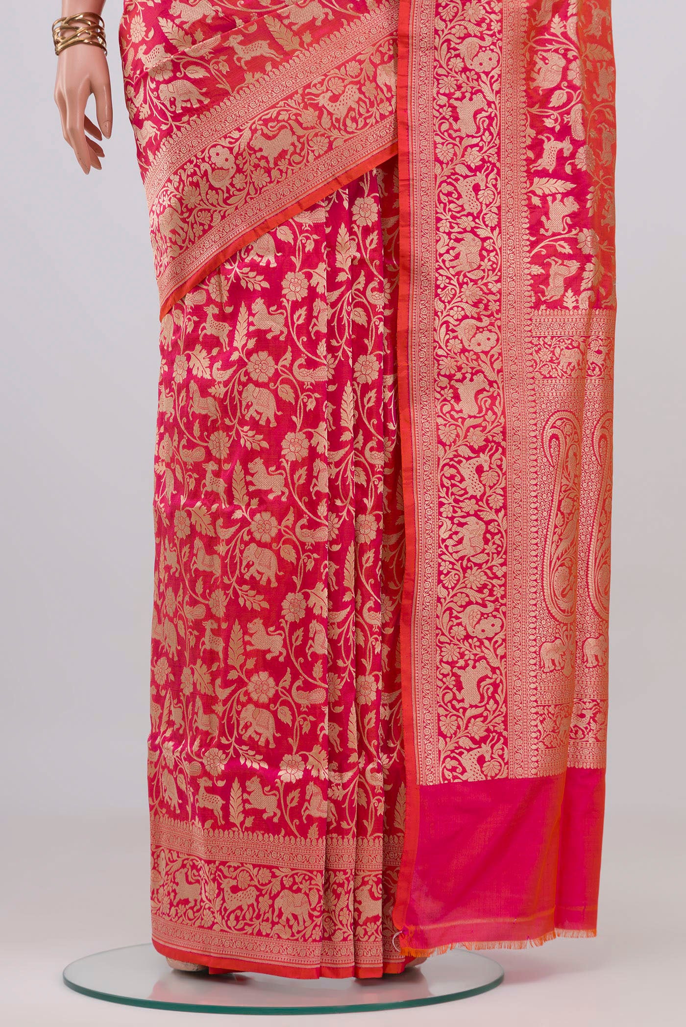 Pleats and pallu of Pink with Orange Color Banarasi Silk Saree with Zari Brocade on the body and Fancy Border. 