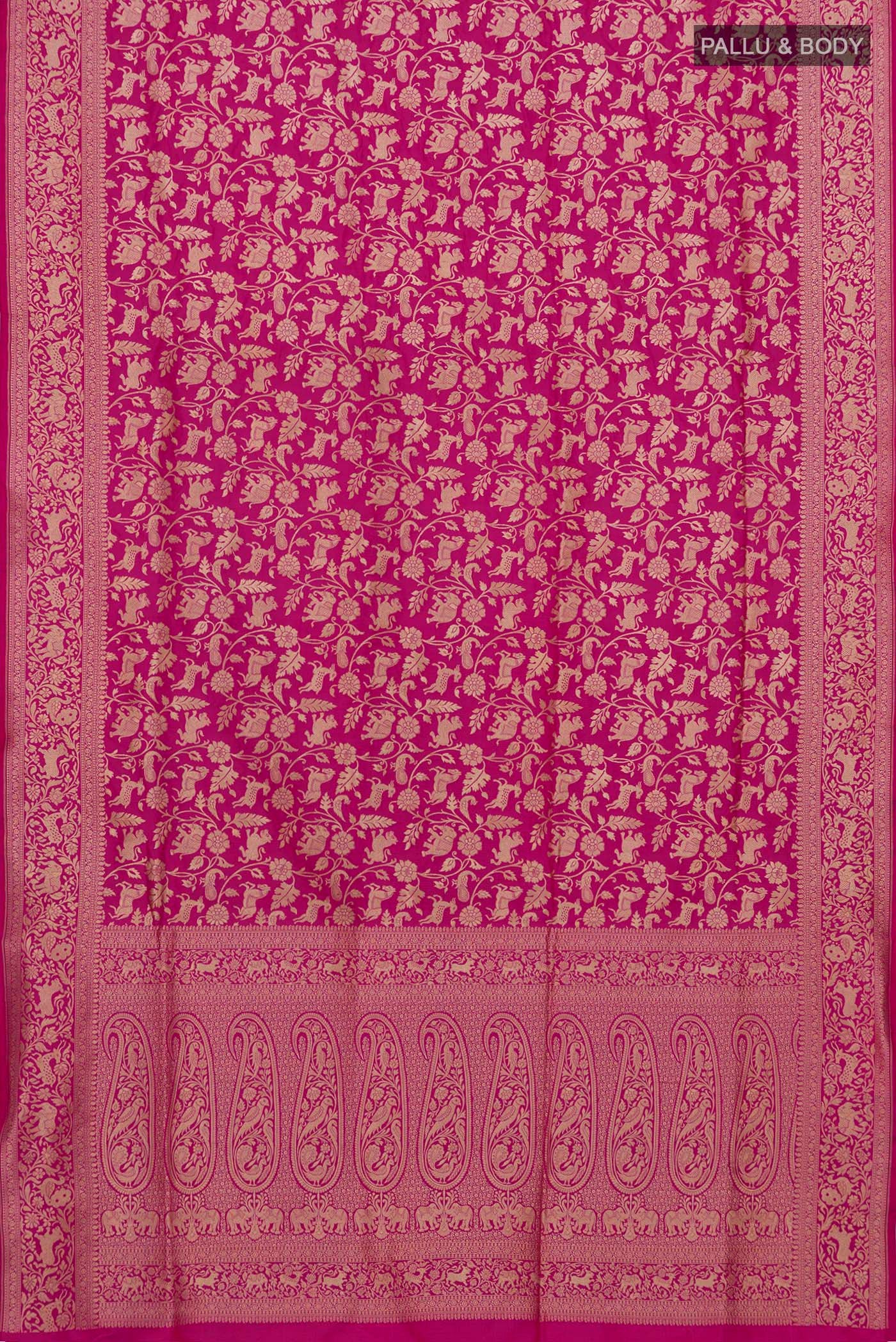 Flat view of Rani Pink Banarasi Silk Saree with Zari Brocade on the body and Zari Border. 