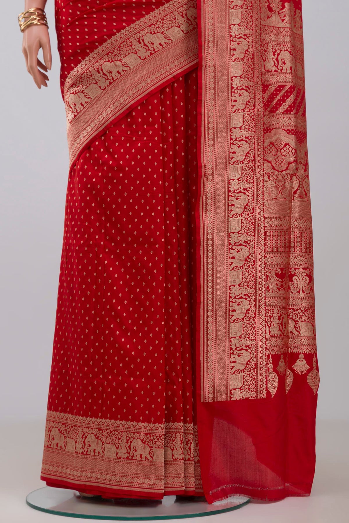 Pleats and pallu of Red Banarasi Saree with Zari Butta on the body and Fancy Border. 