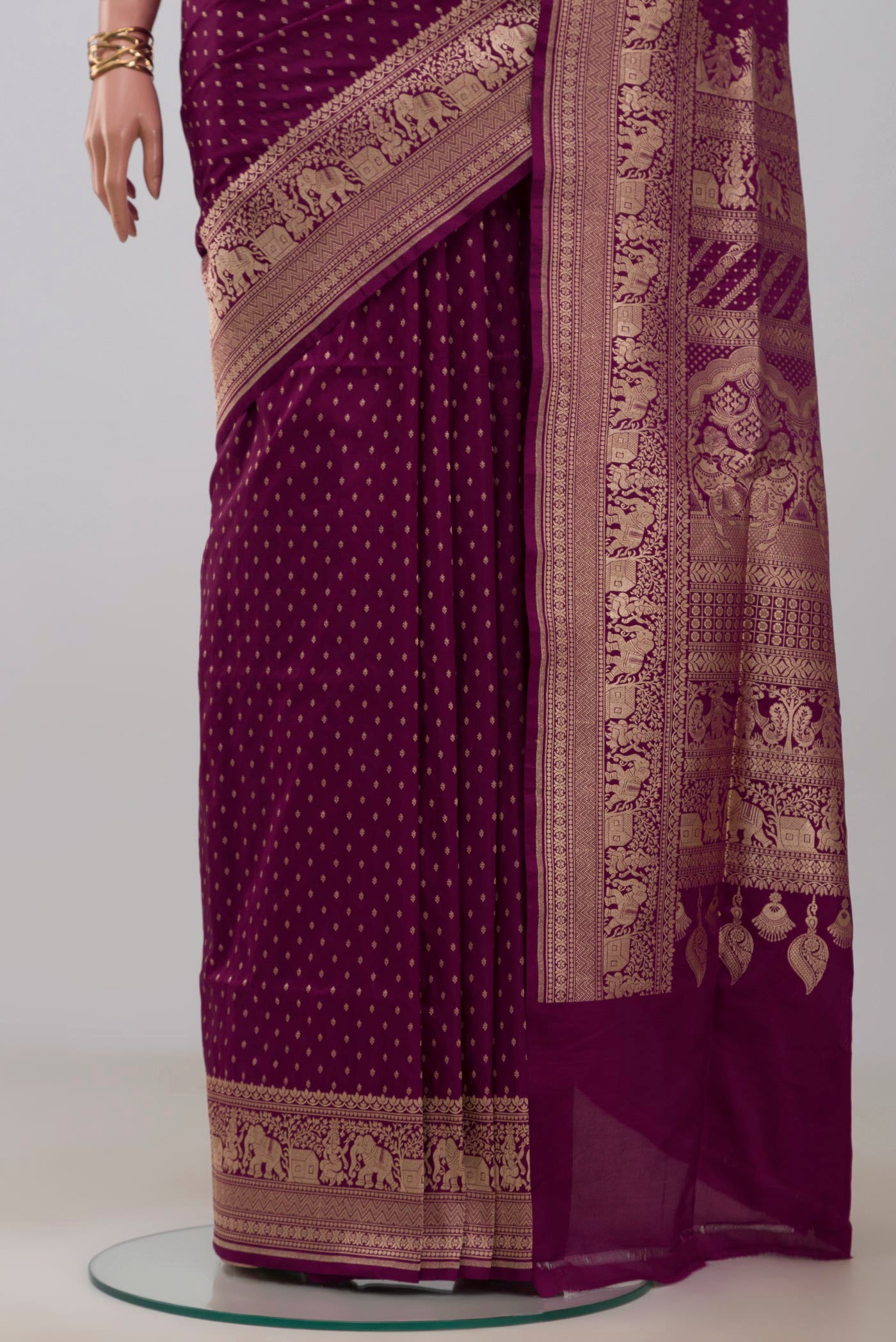 Pleats and pallu of Purple Banarasi Silk Saree with Zari Butta on the body and Zari Border. 