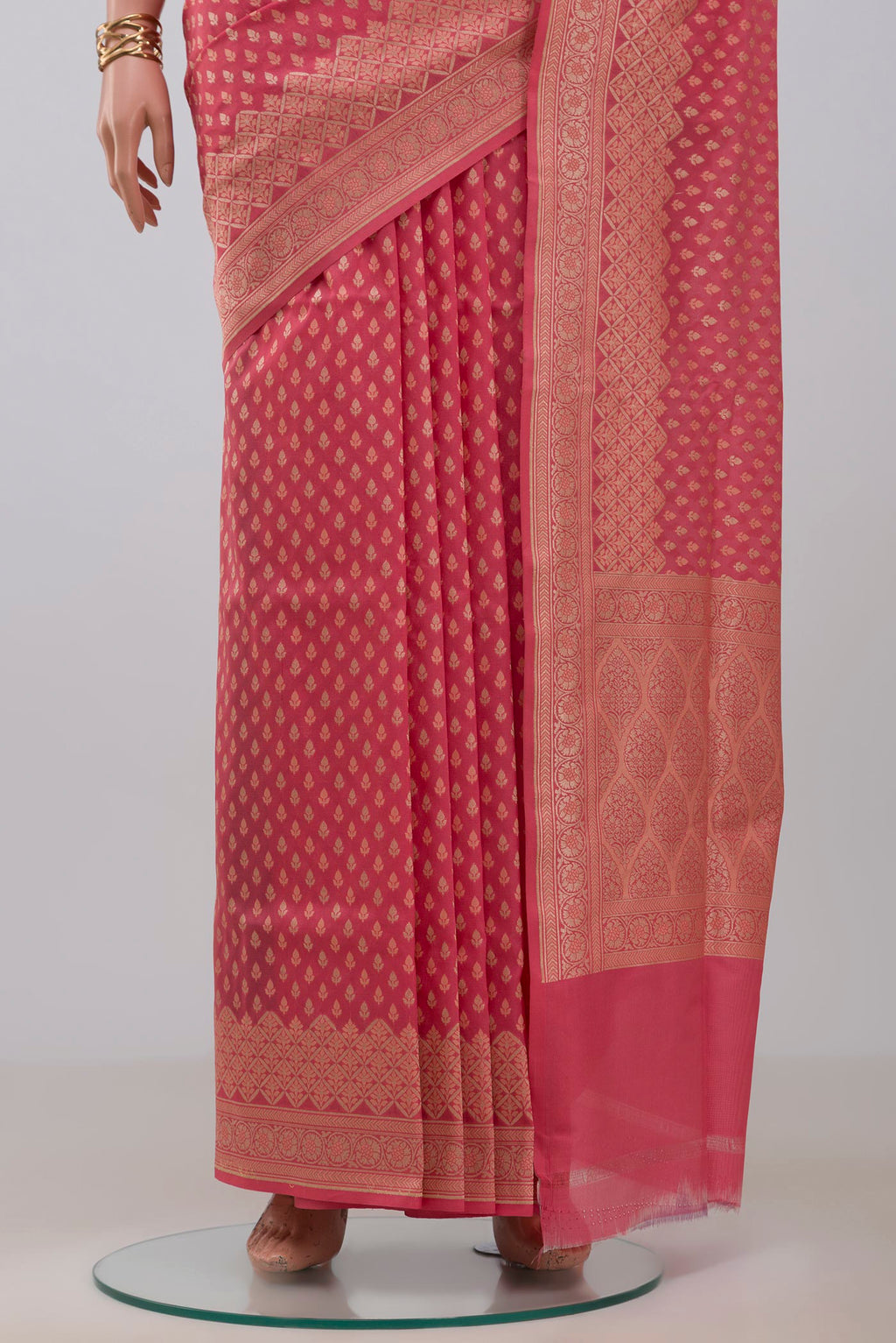 Pleats and pallu of Coral Banarasi Silk Saree with Zari Butta on the body and Zari Border. 