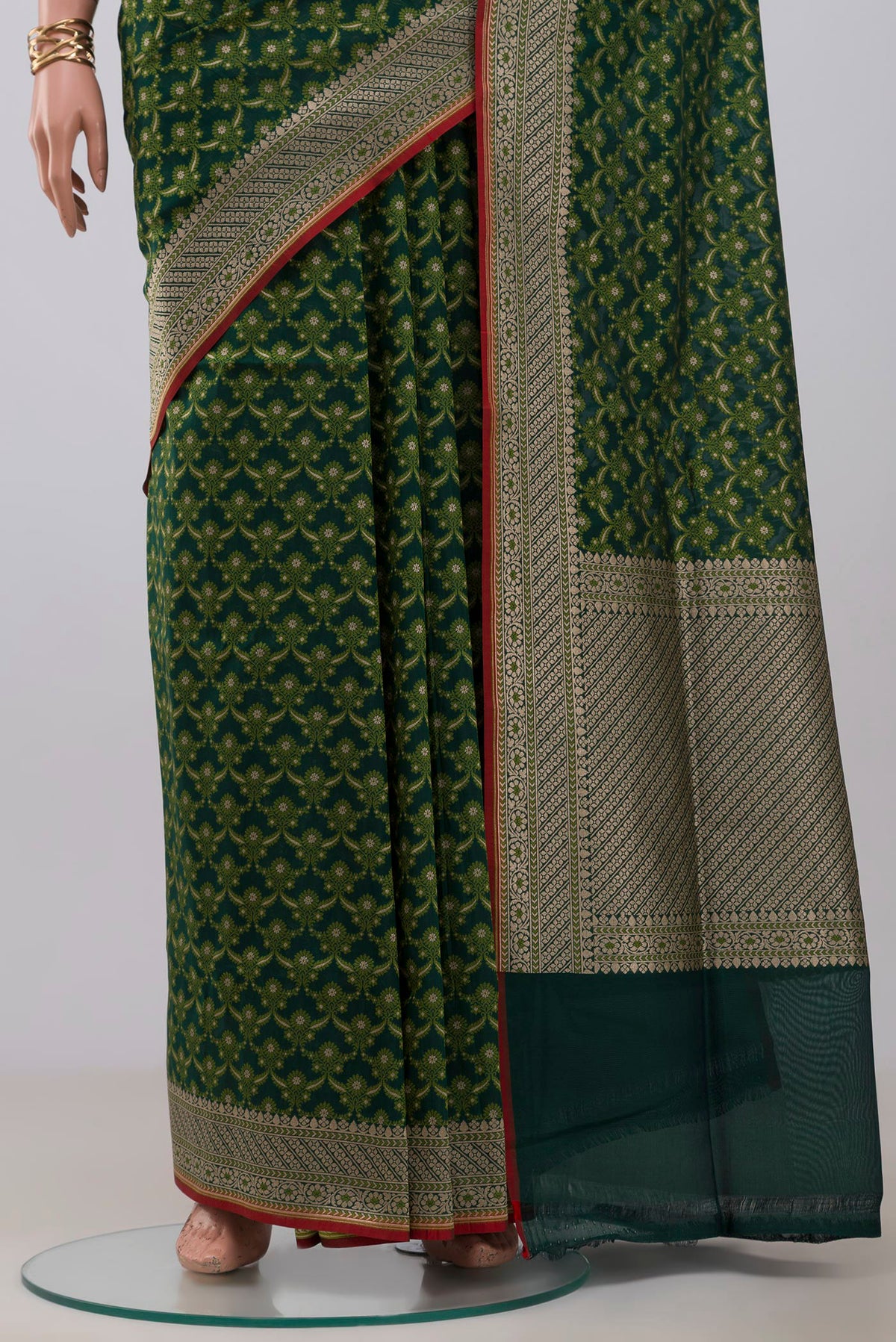 Pleats and pallu of Green Banarasi Saree with Fancy on the body and Fancy Border. 