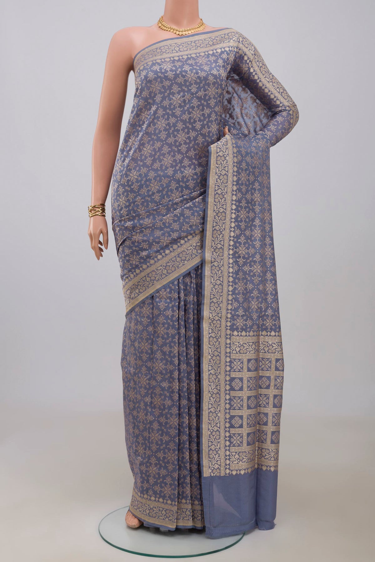 Blue Grey Banarasi Saree with Fancy on the body and Fancy Border.  displayed on a mannequin
