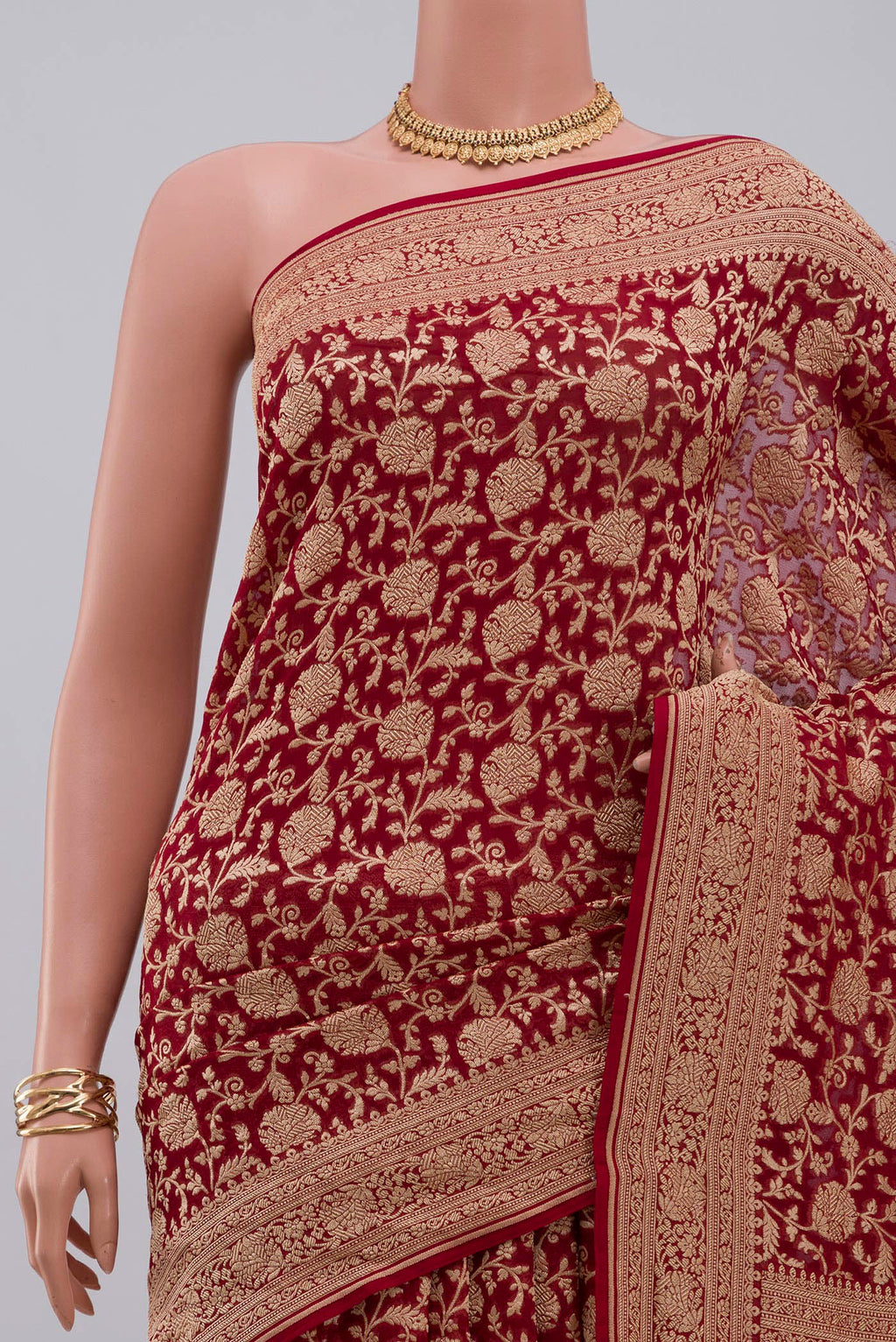 Border image of Red Georgette Saree with Fancy on the body and Zari Border. 