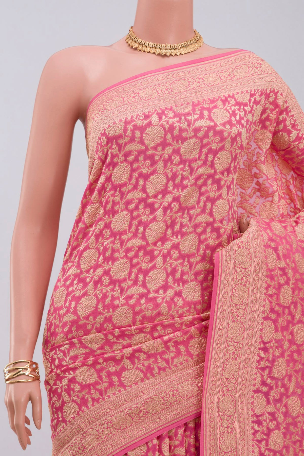Border image of Pink Georgette Saree with Fancy on the body and Zari Border. 