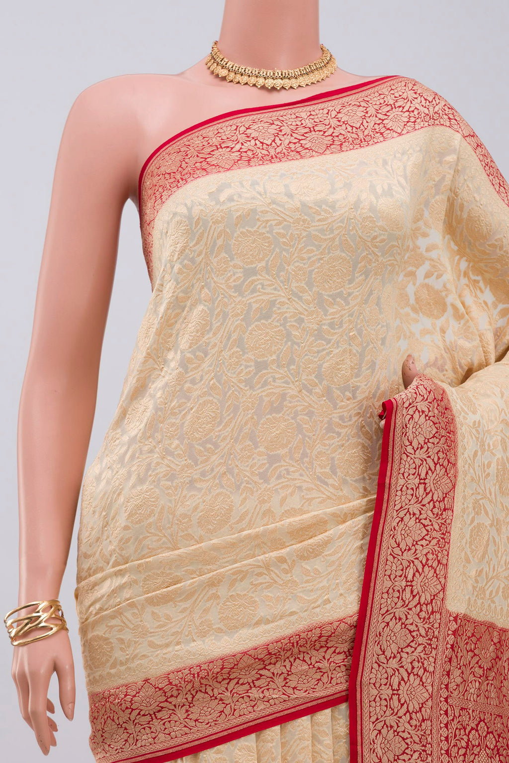 Border image of Cream Georgette Saree with Fancy on the body and Zari Border. 