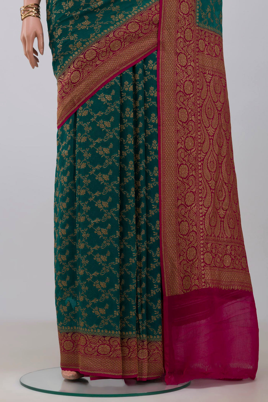 Pleats and pallu of Green Georgette Saree with Fancy on the body and Fancy Border. 