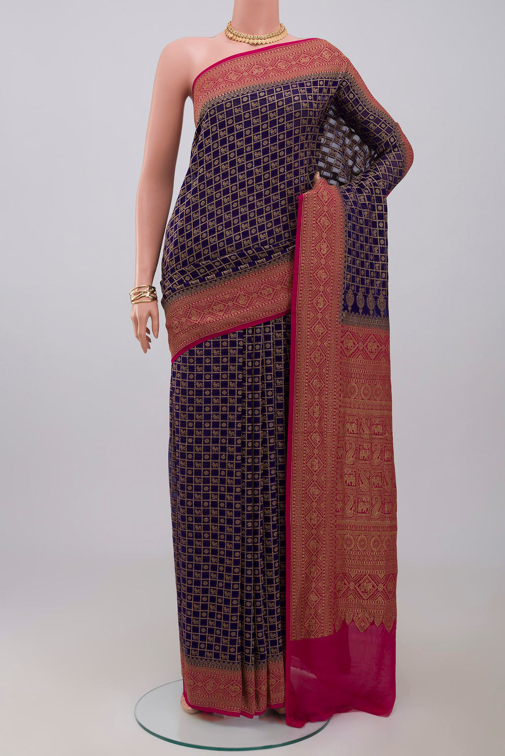 Blue Georgette Saree with Fancy on the body and Zari Border.  displayed on a mannequin