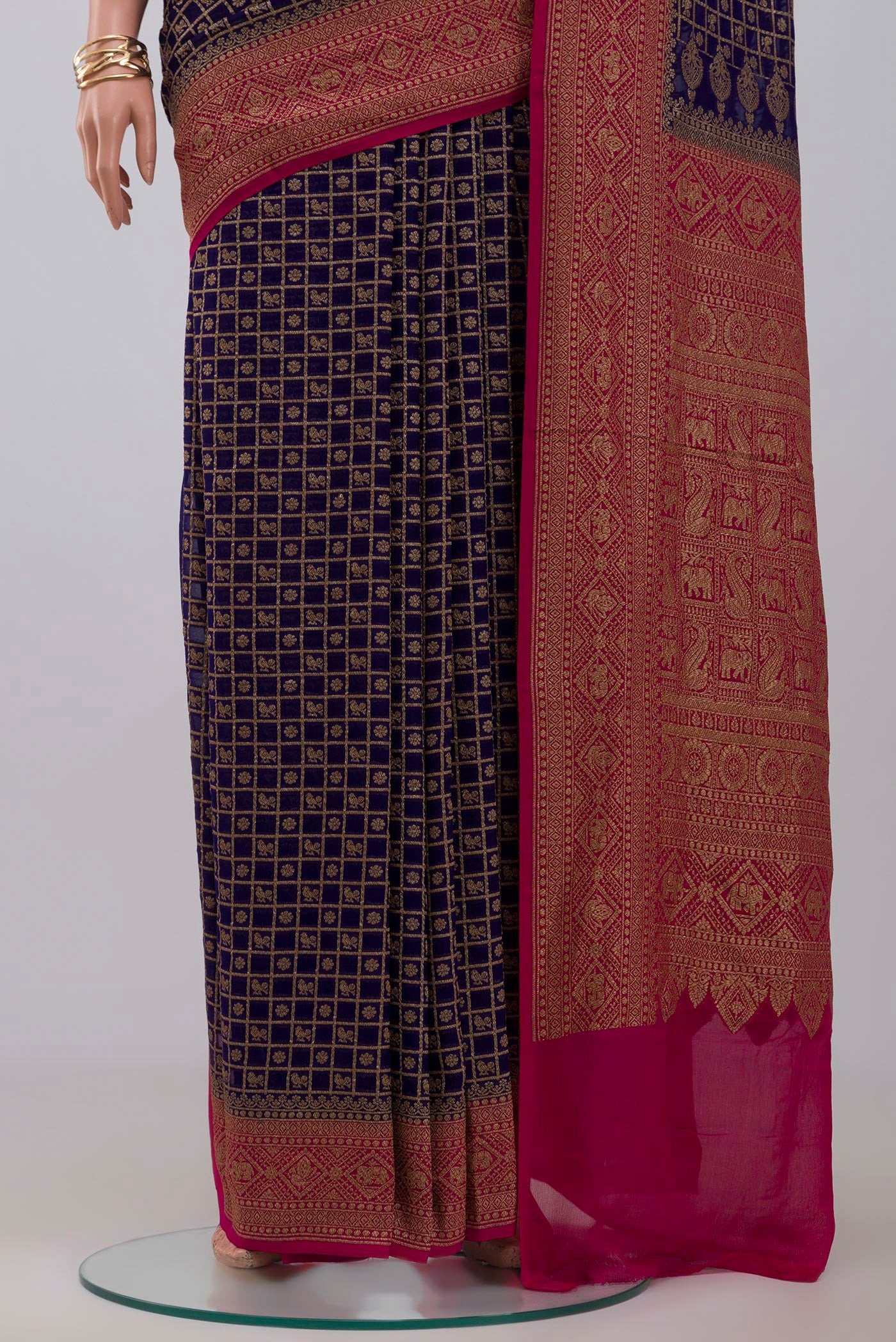 Pleats and pallu of Blue Georgette Saree with Fancy on the body and Zari Border. 