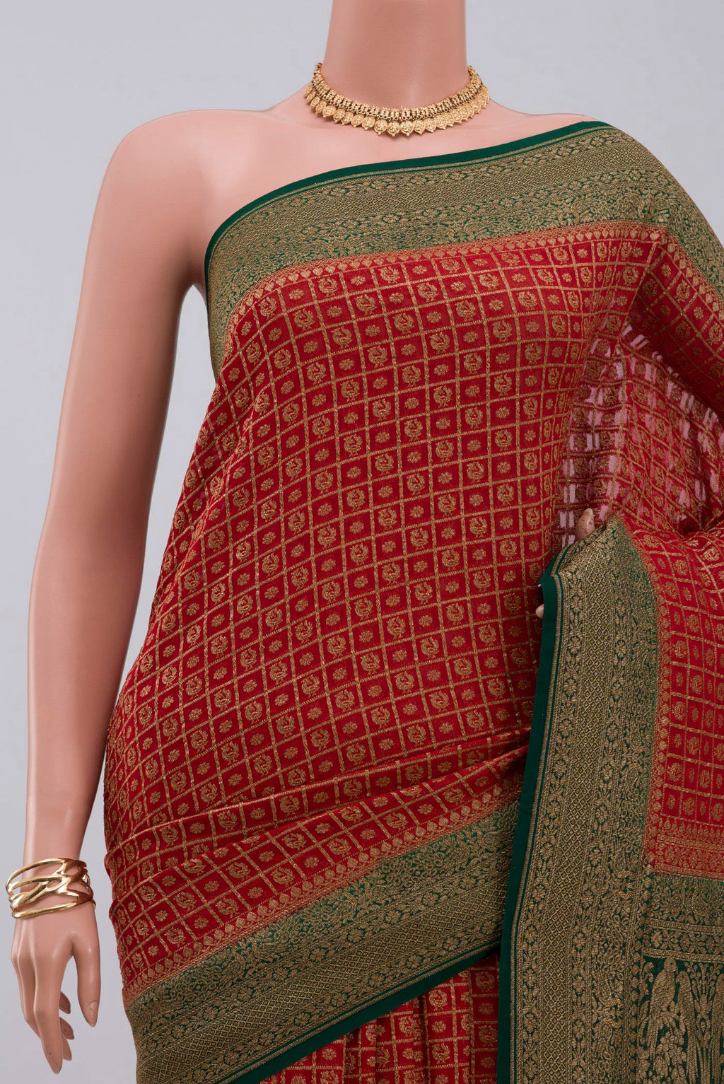 Border image of Maroon Georgette Saree with Fancy on the body and Zari Border. 