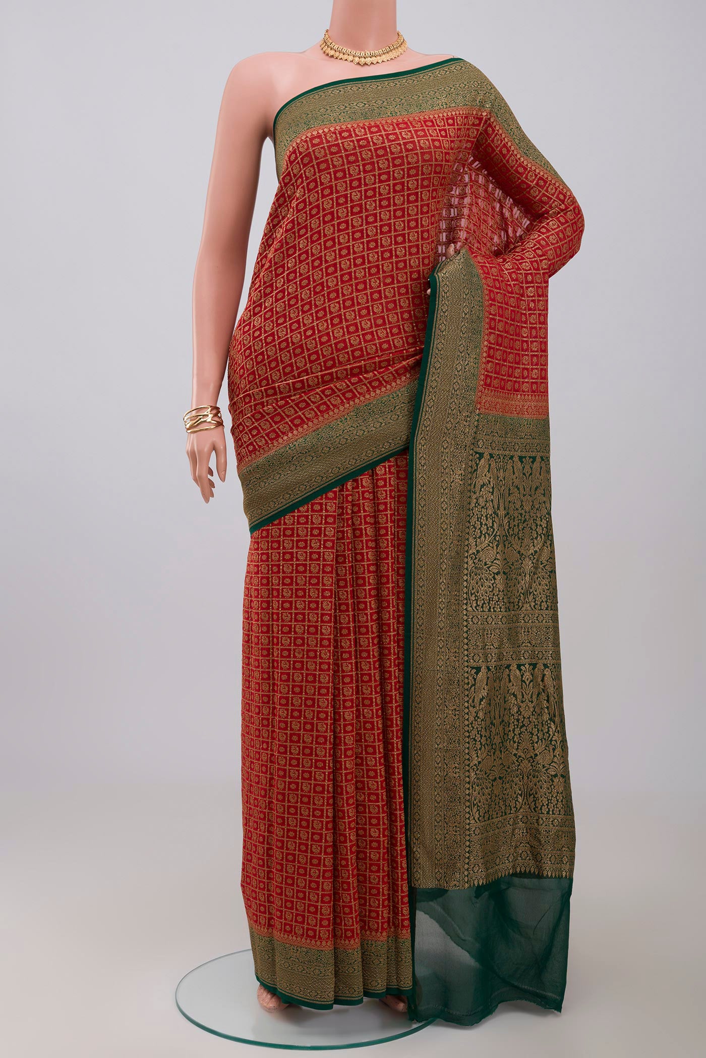 Maroon Georgette Saree with Fancy on the body and Zari Border.  displayed on a mannequin