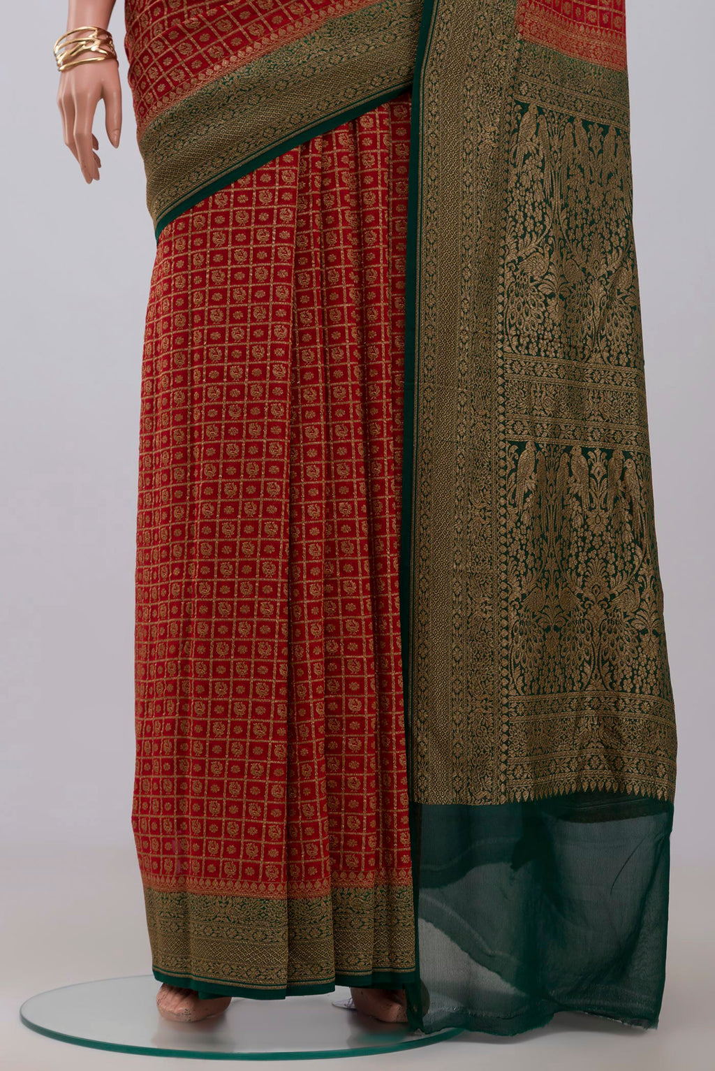 Pleats and pallu of Maroon Georgette Saree with Fancy on the body and Zari Border. 