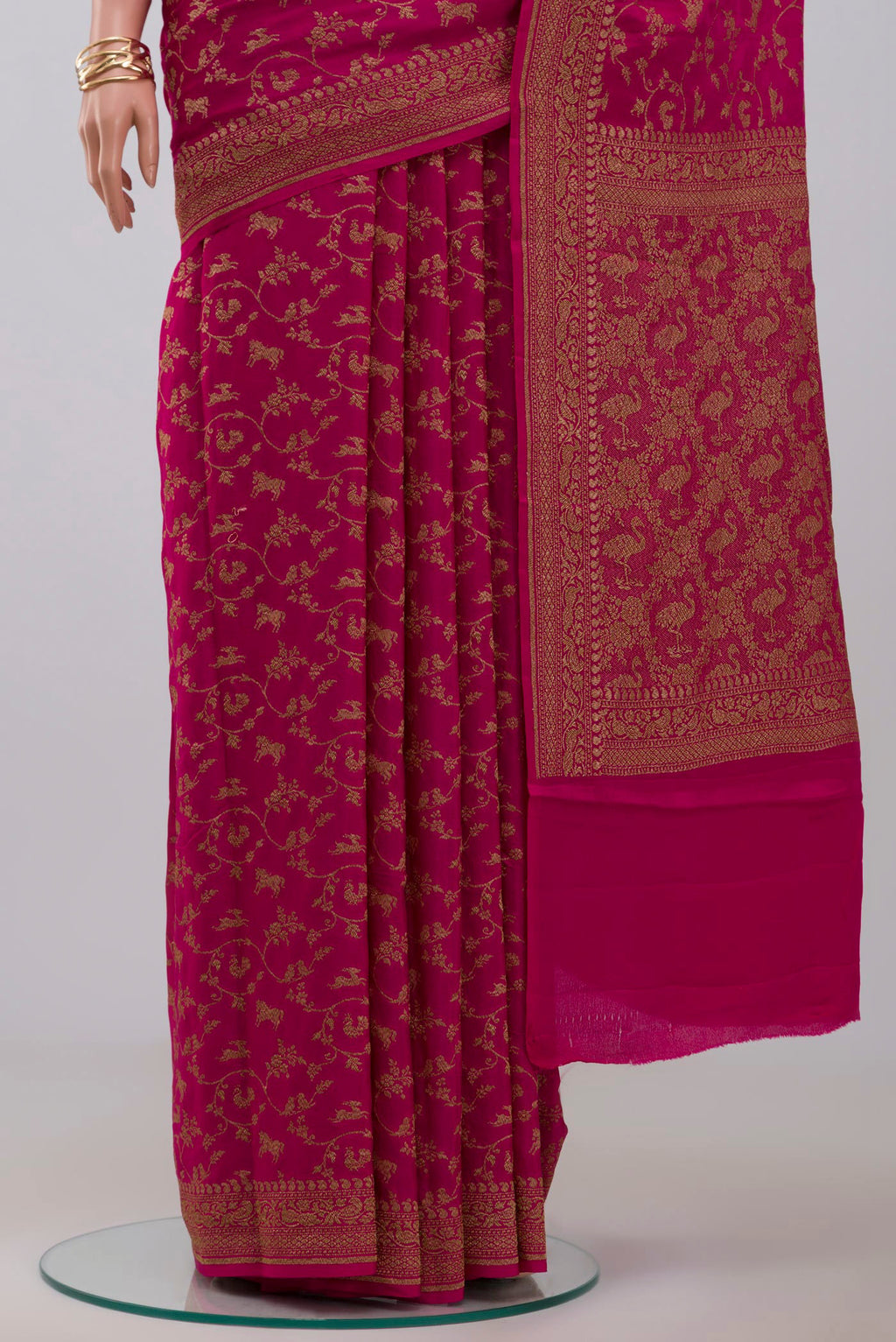 Pleats and pallu of Pink Georgette Saree with Fancy on the body and Zari Border. 