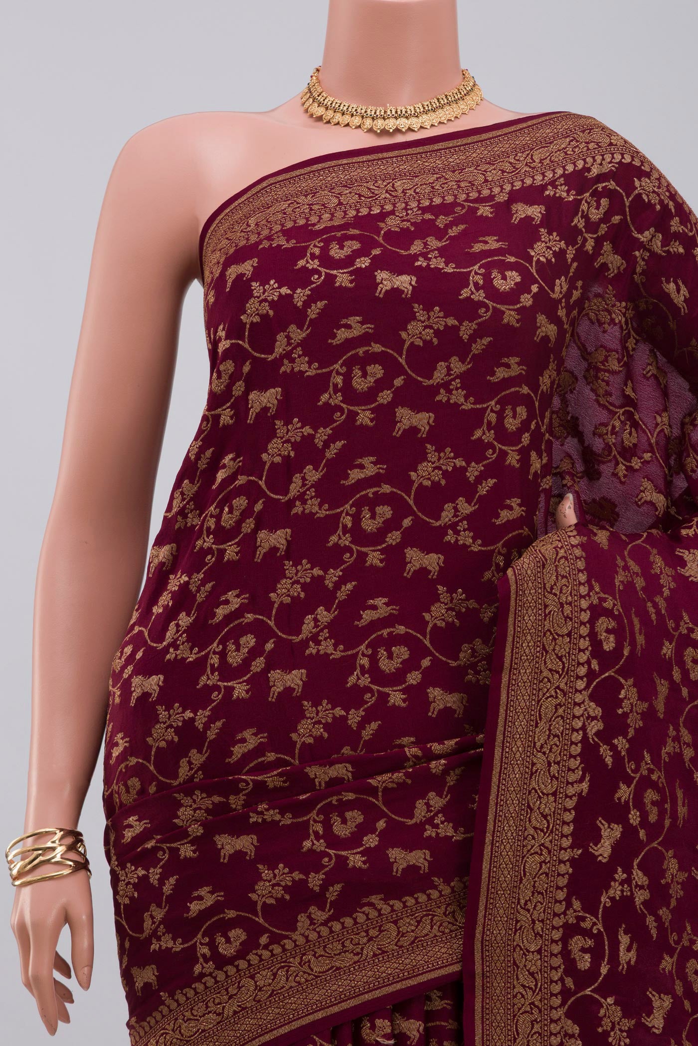 Border image of Brown Georgette Saree with Fancy on the body and Zari Border. 