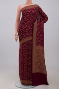 Brown Georgette Saree with Fancy on the body and Zari Border.  displayed on a mannequin