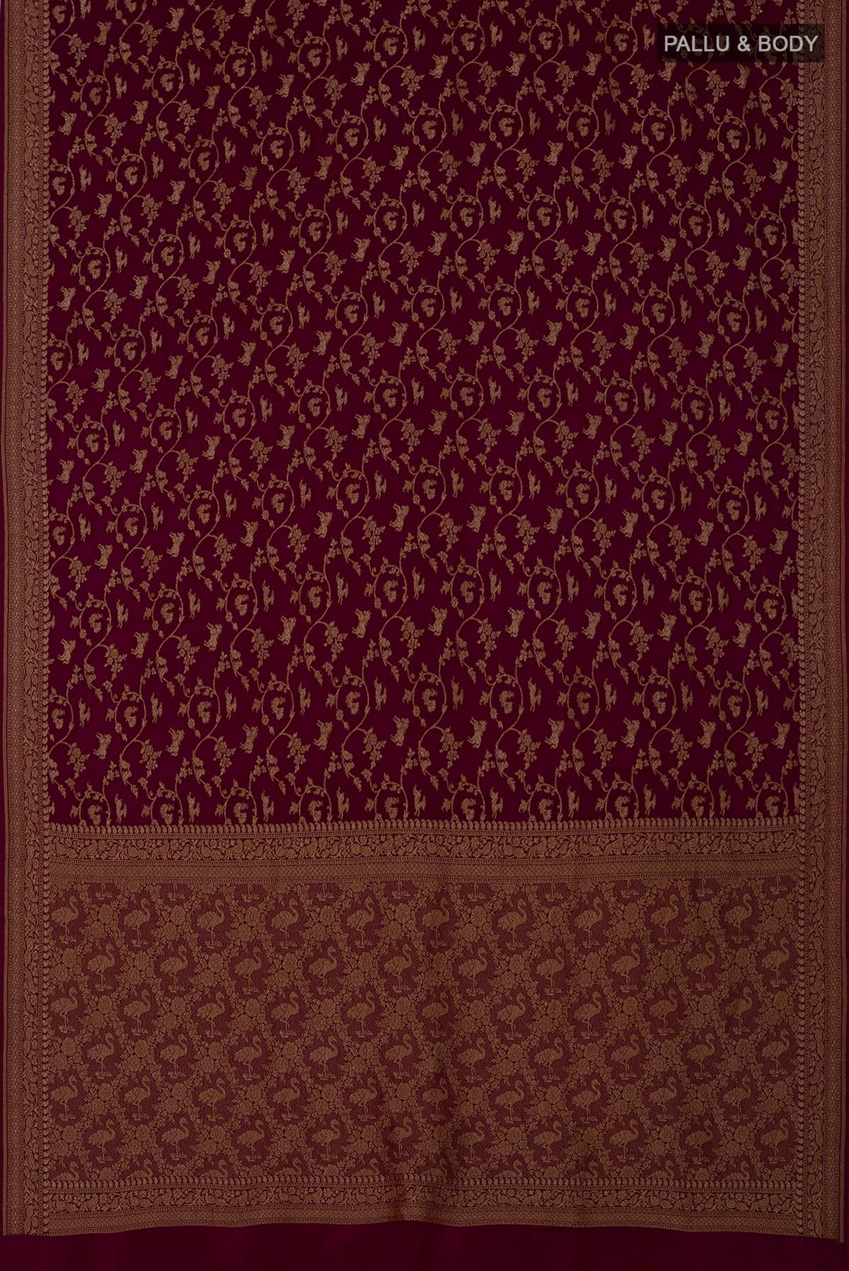 Flat view of Brown Georgette Saree with Fancy on the body and Zari Border. 
