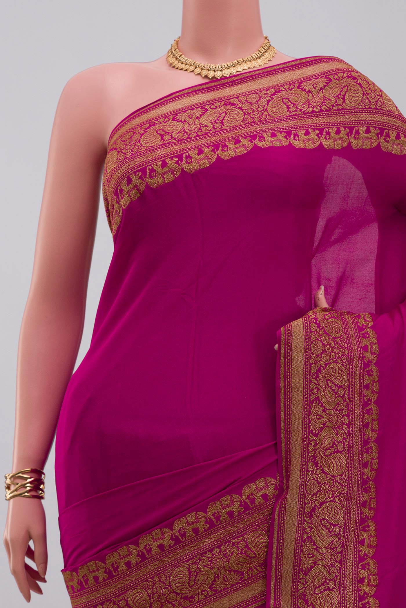 Border image of Pink Georgette Saree with Plain Body and Fancy Border. 
