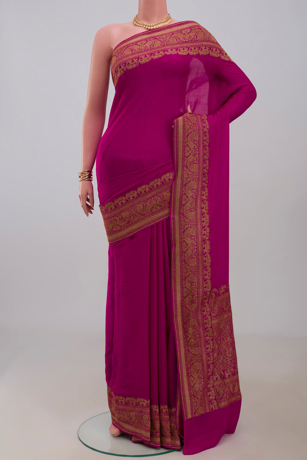 Pink Georgette Saree with Plain Body and Fancy Border.  displayed on a mannequin