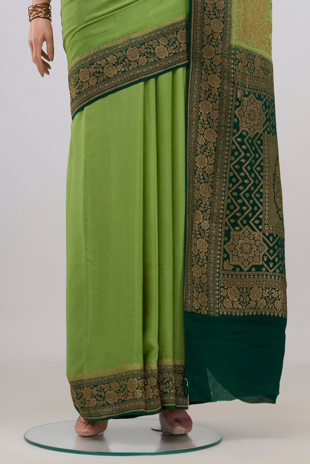 Pleats and pallu of Pista Green Banarasi Georgette Saree with Plain Body and Zari Border. 