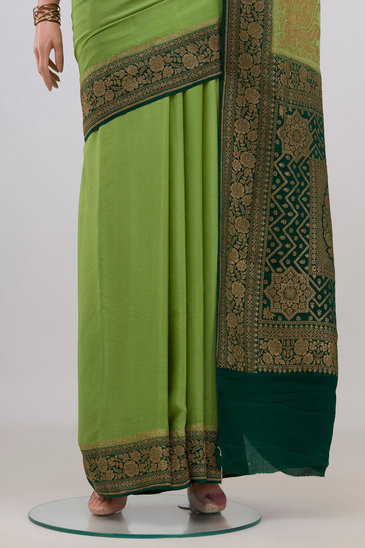 Pleats and pallu of Pista Green Banarasi Georgette Saree with Plain Body and Zari Border. 