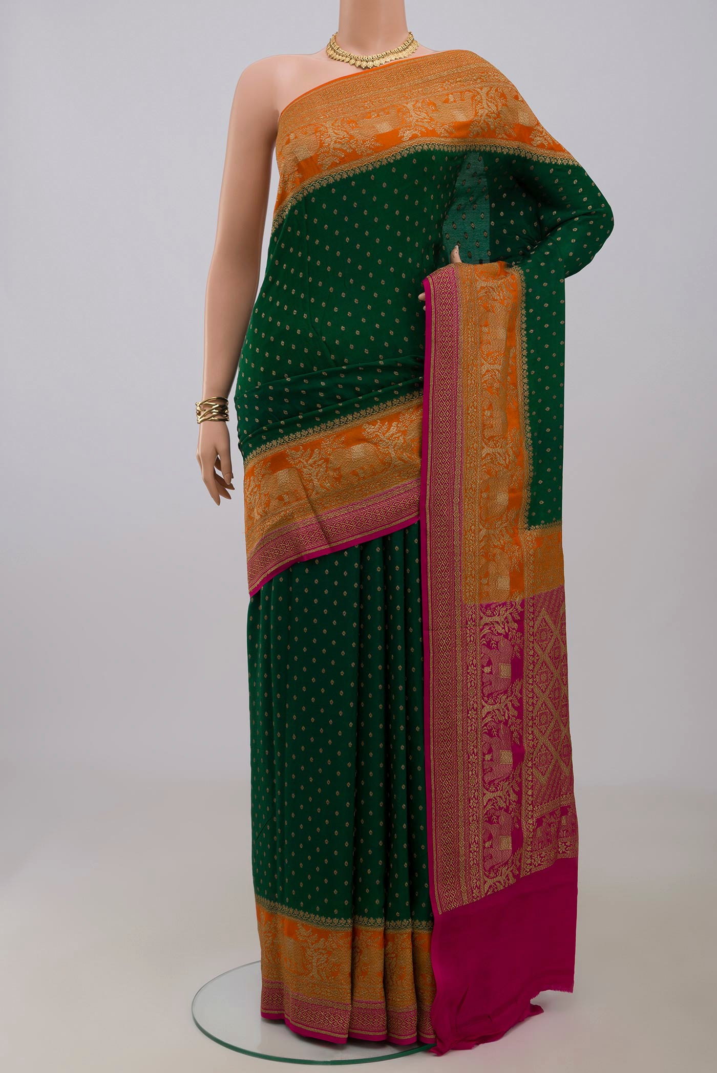 Green Georgette Saree with Fancy on the body and Fancy Border.  displayed on a mannequin