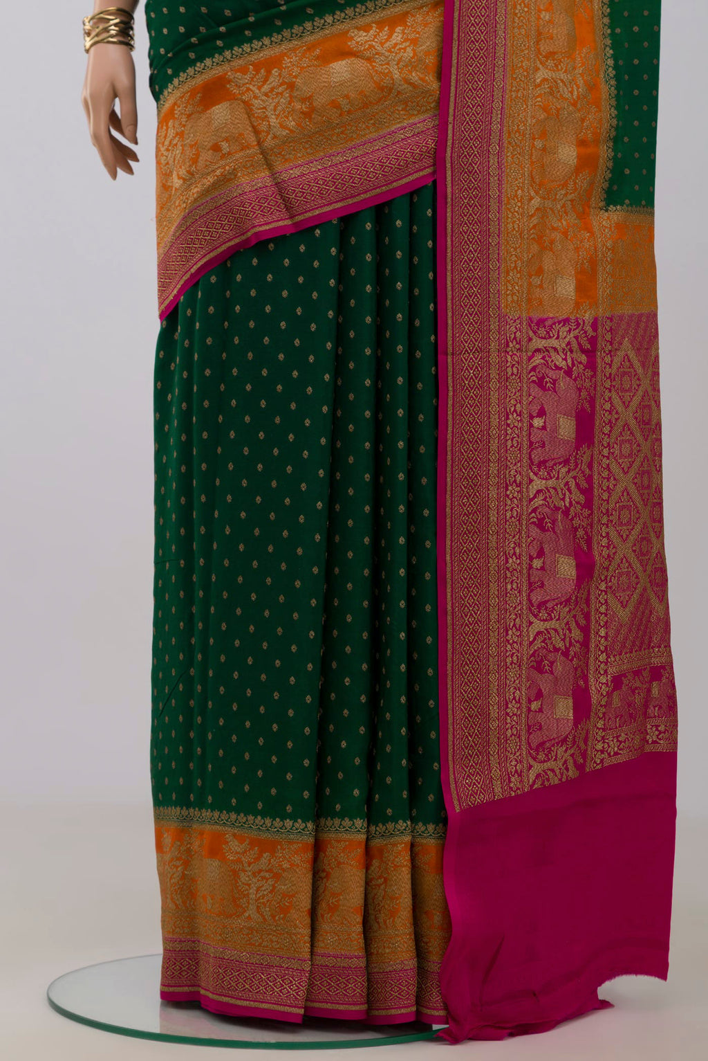 Pleats and pallu of Green Georgette Saree with Fancy on the body and Fancy Border. 