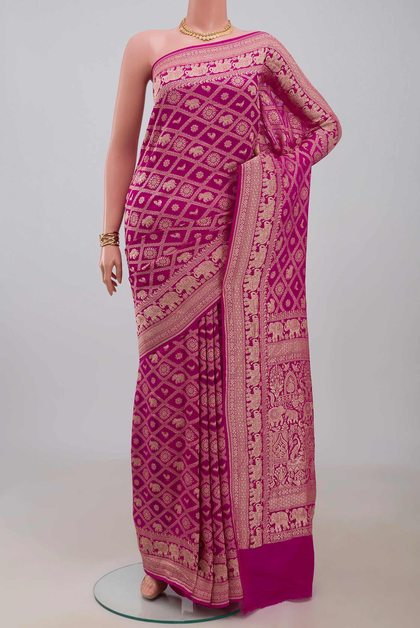 Pink Georgette Saree with Fancy on the body and Fancy Border.  displayed on a mannequin