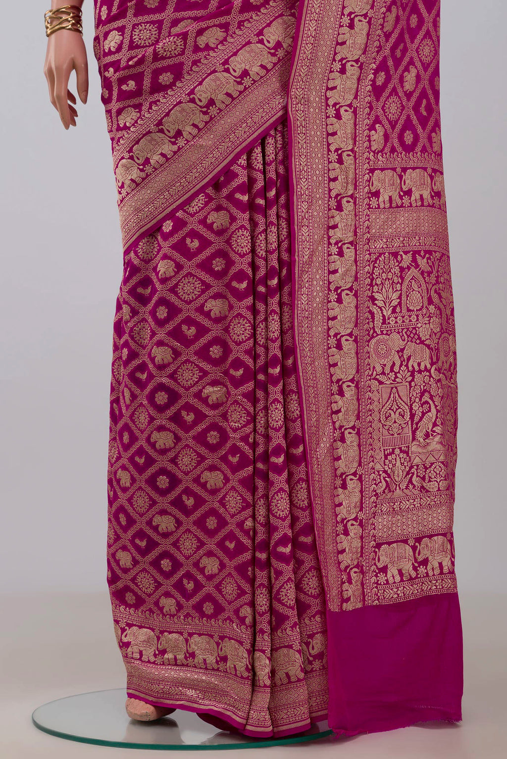 Pleats and pallu of Pink Georgette Saree with Fancy on the body and Fancy Border. 