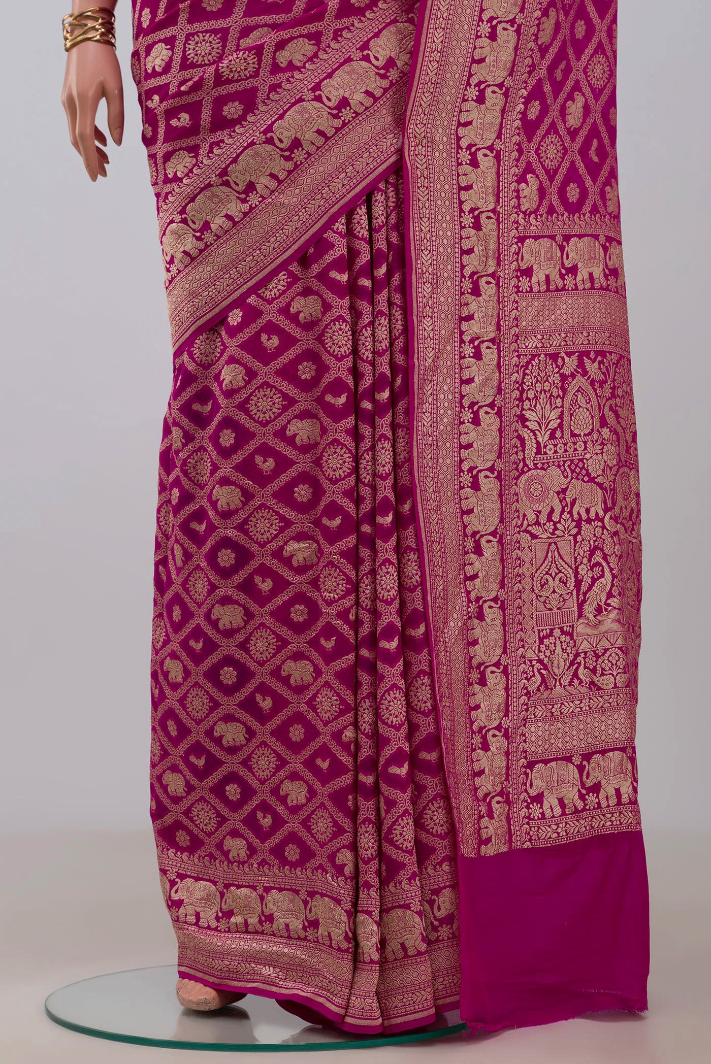 Pleats and pallu of Pink Georgette Saree with Fancy on the body and Fancy Border. 