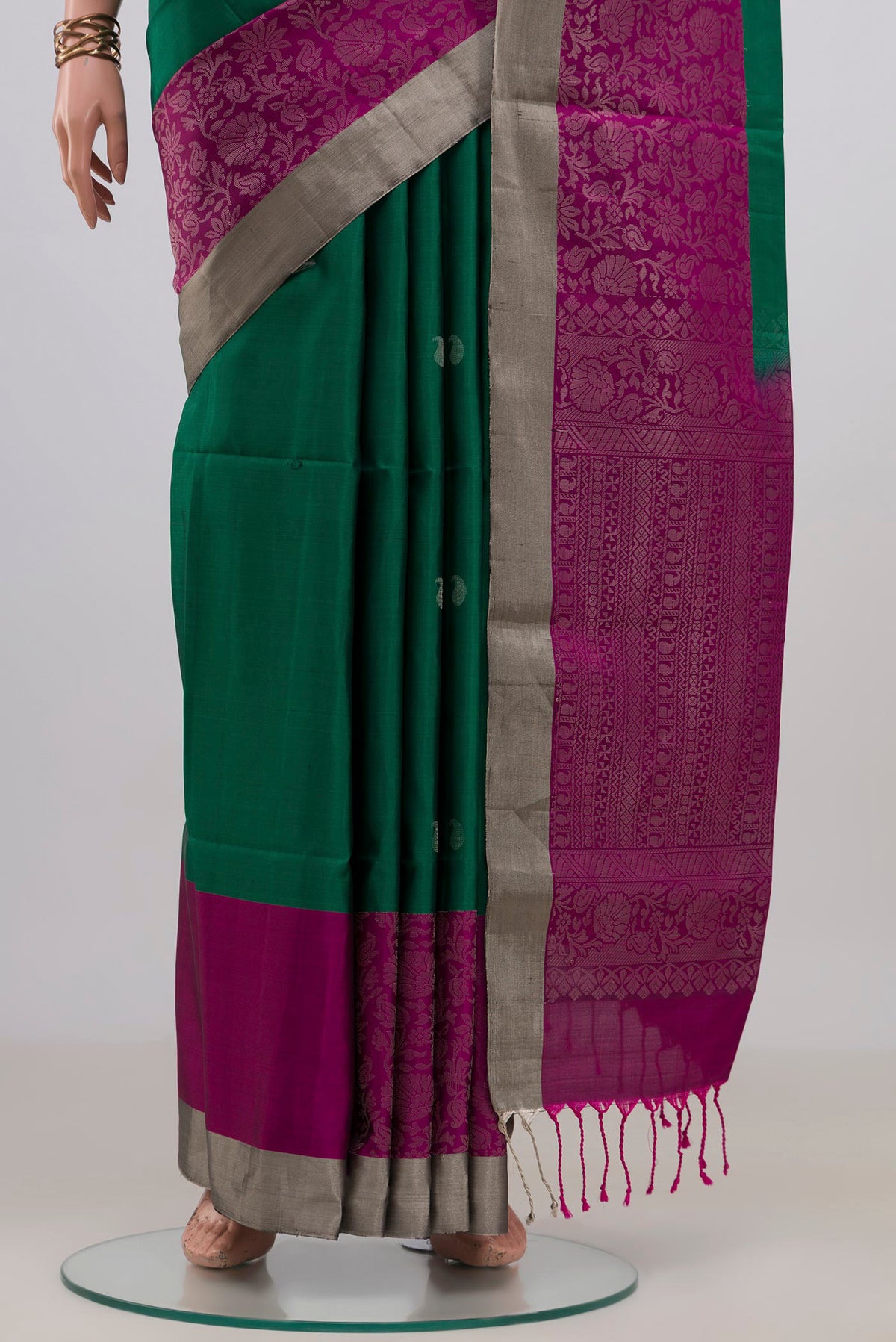 Pleats and pallu of Pure Silk Green Soft Saree with Zari Butta on the body and Zari Border. 