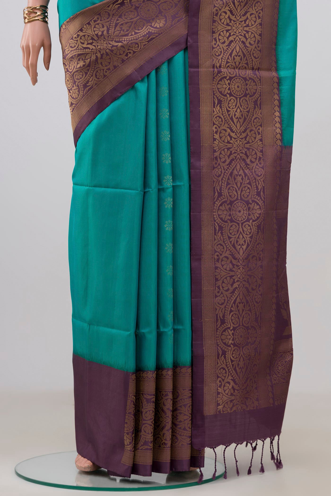 Pleats and pallu of Peacock Blue Soft Silk Saree with Zari Butta on the body and Fancy Border. 