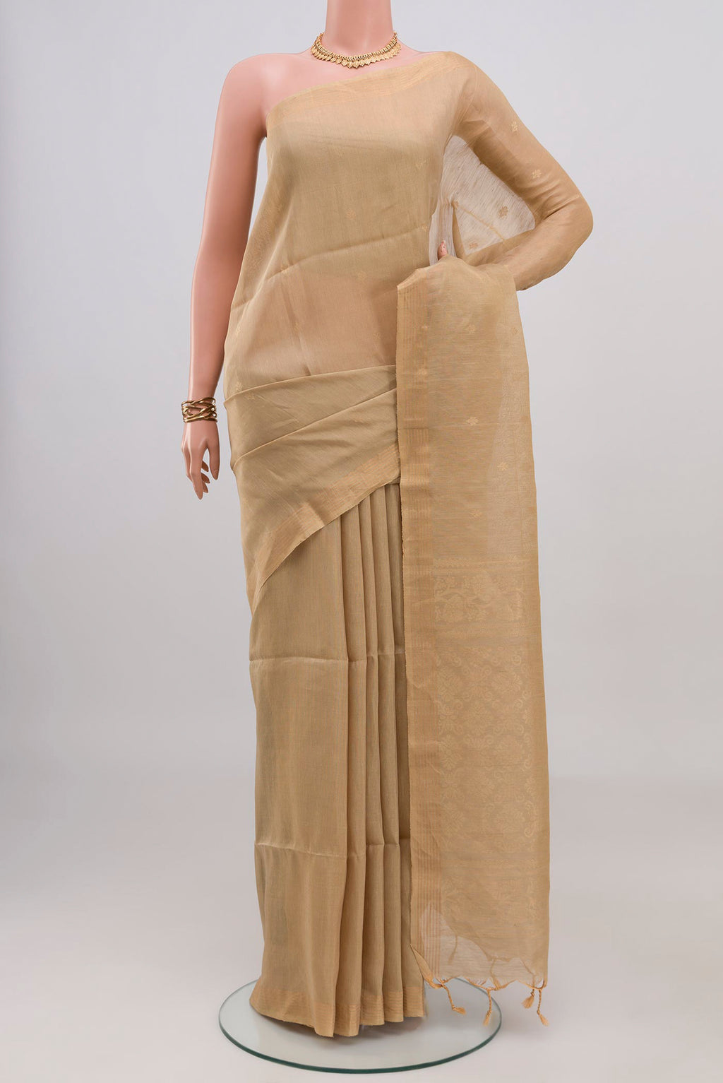 Beige Soft Silk Saree with Zari Butta on the body and Thin Zari Line.  displayed on a mannequin