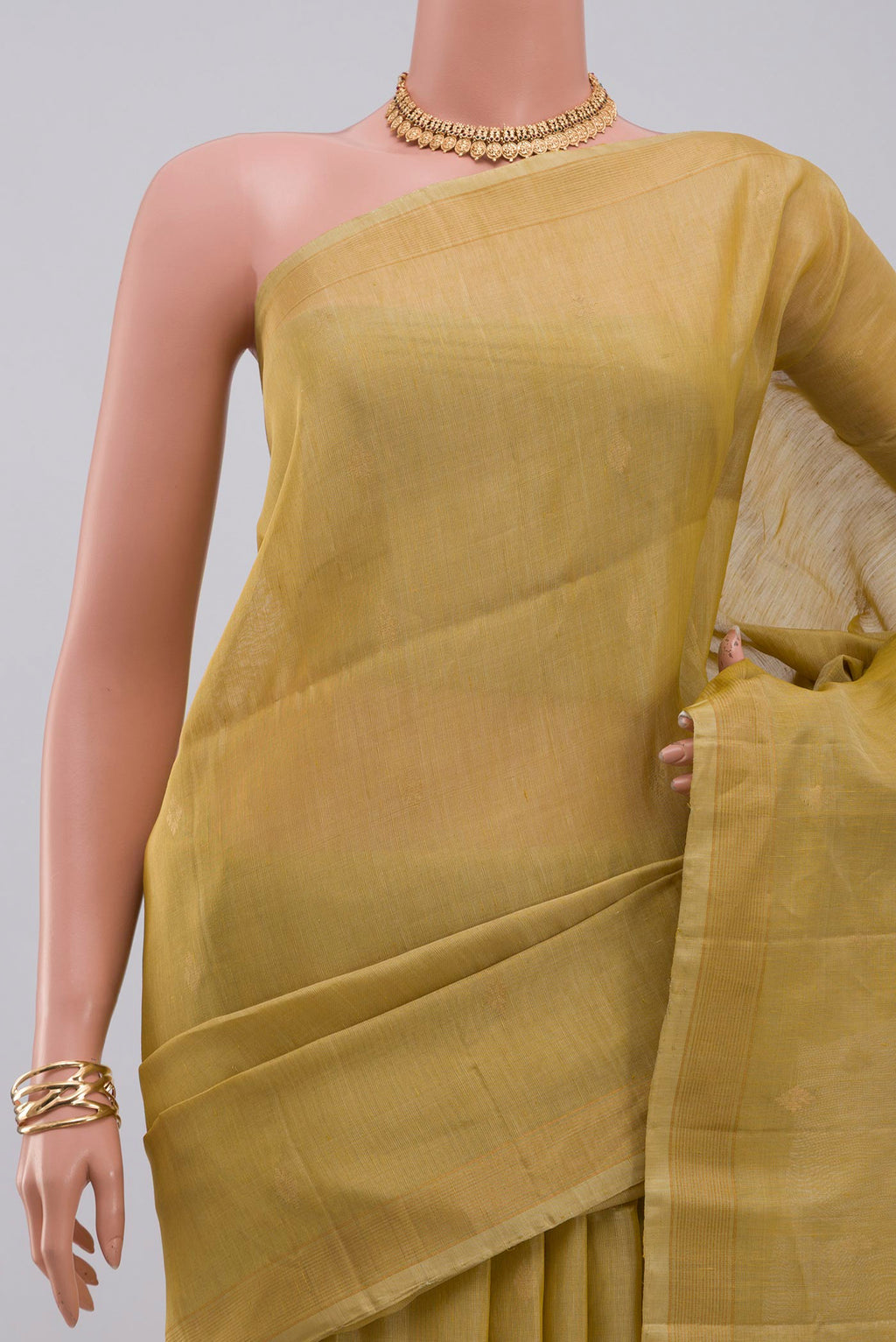 Border image of Beige Soft Silk Saree with Zari Butta on the body and Thin Zari Line. 