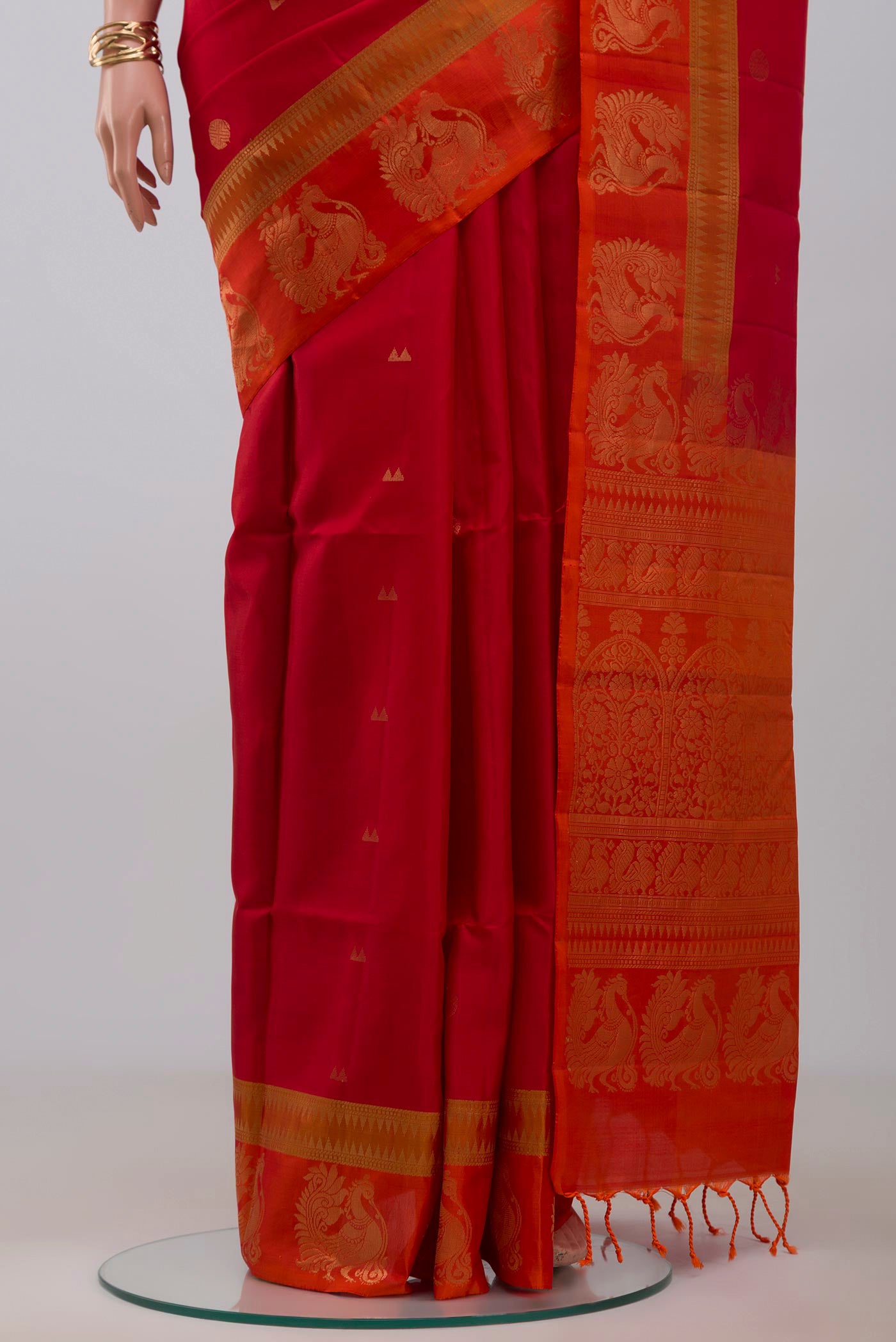 Pleats and pallu of Red Soft Silk Saree with Zari Butta on the body and Fancy Border. 