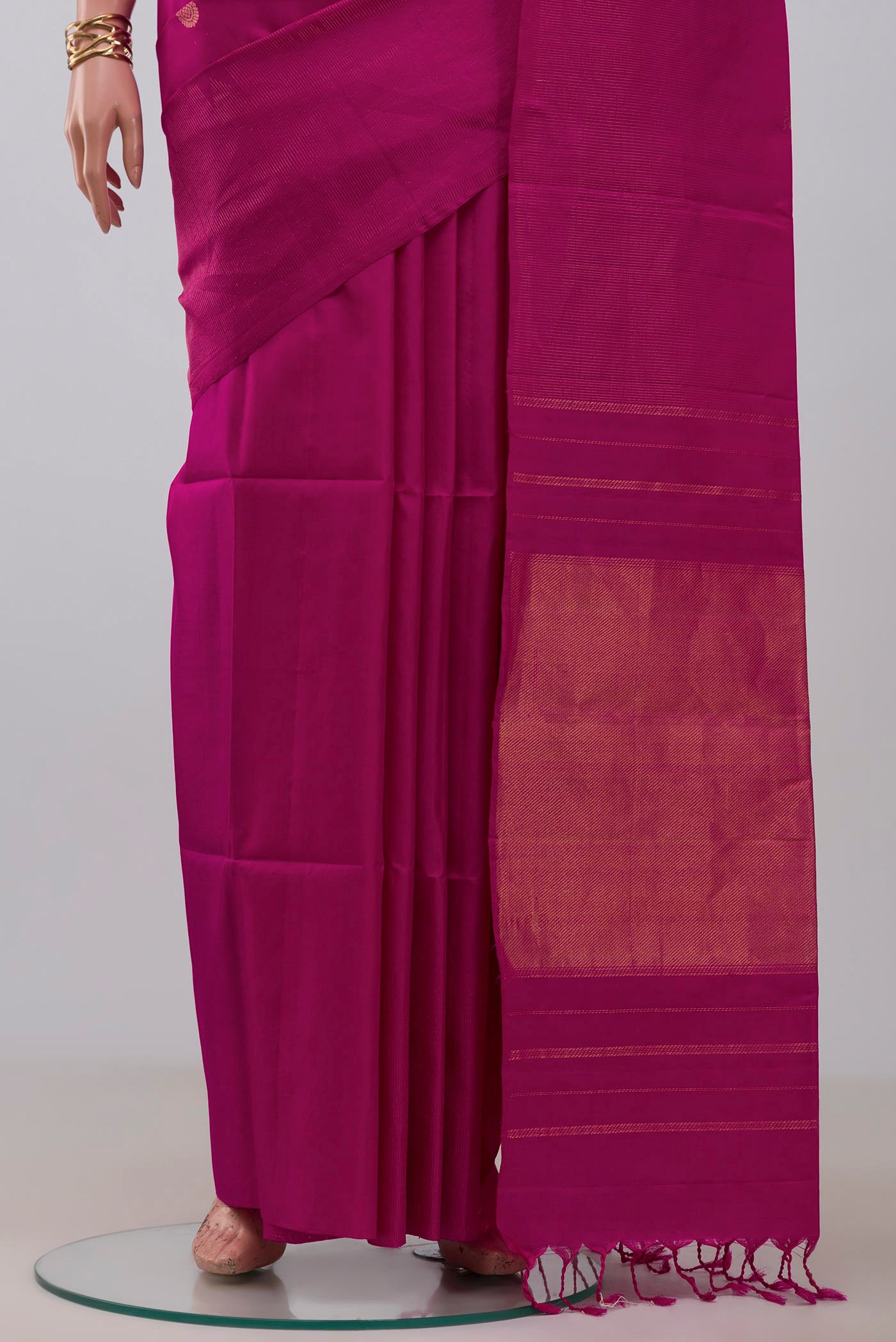 Pleats and pallu of Magenta Soft Silk Saree with Zari Butta on the body and Fancy Border. 