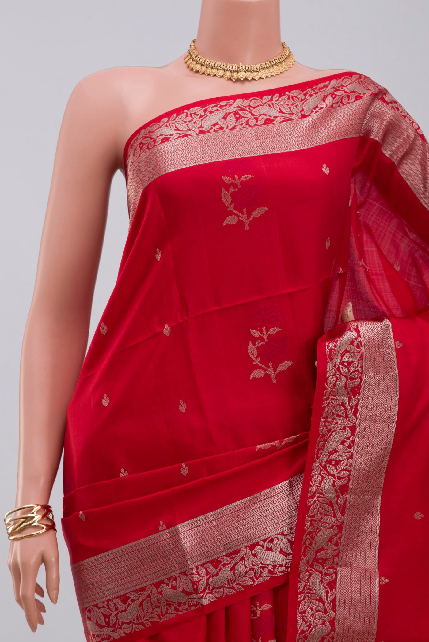 Border image of Red Soft Silk Saree with Zari Butta on the body and Zari Border. 