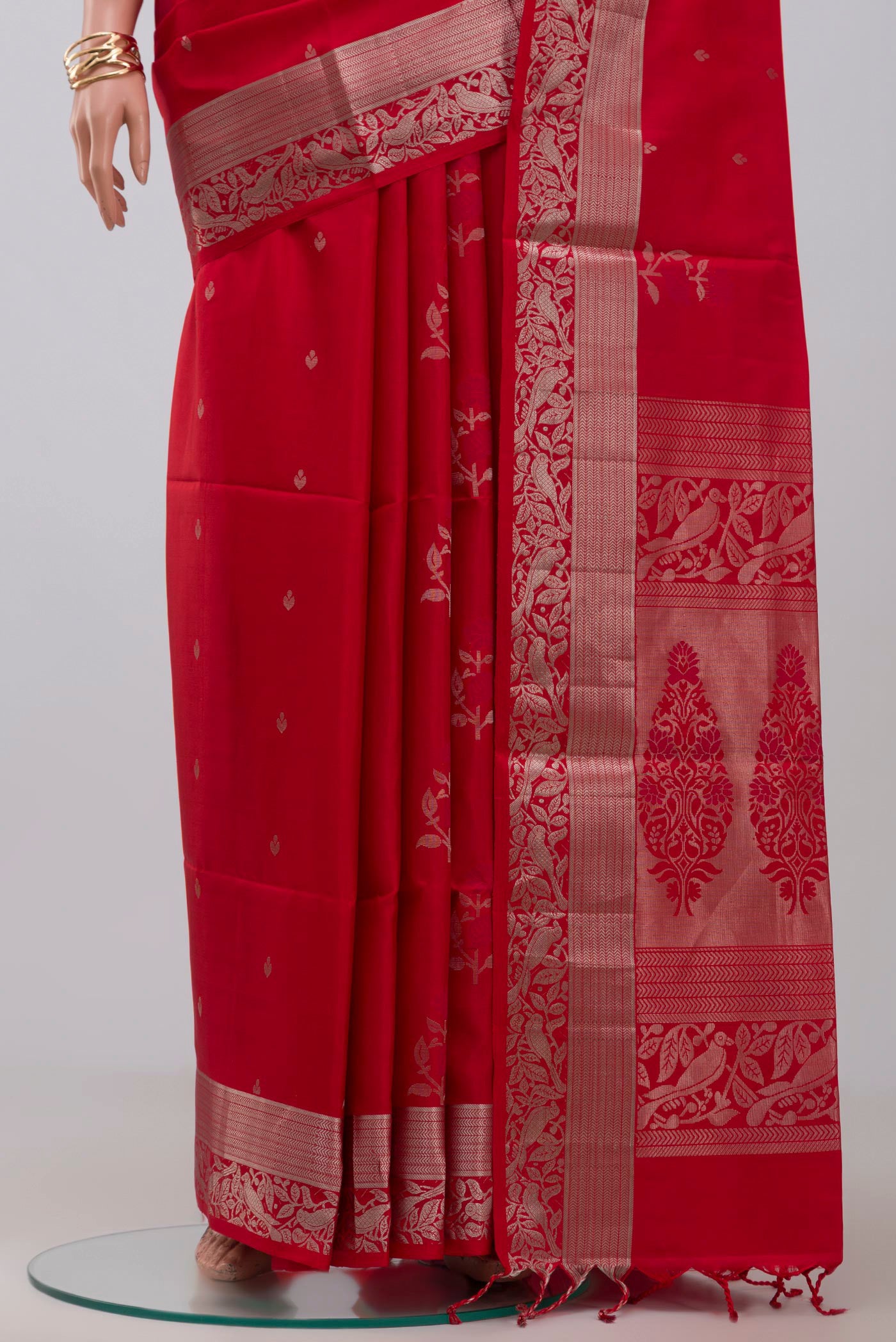 Pleats and pallu of Red Soft Silk Saree with Zari Butta on the body and Zari Border. 