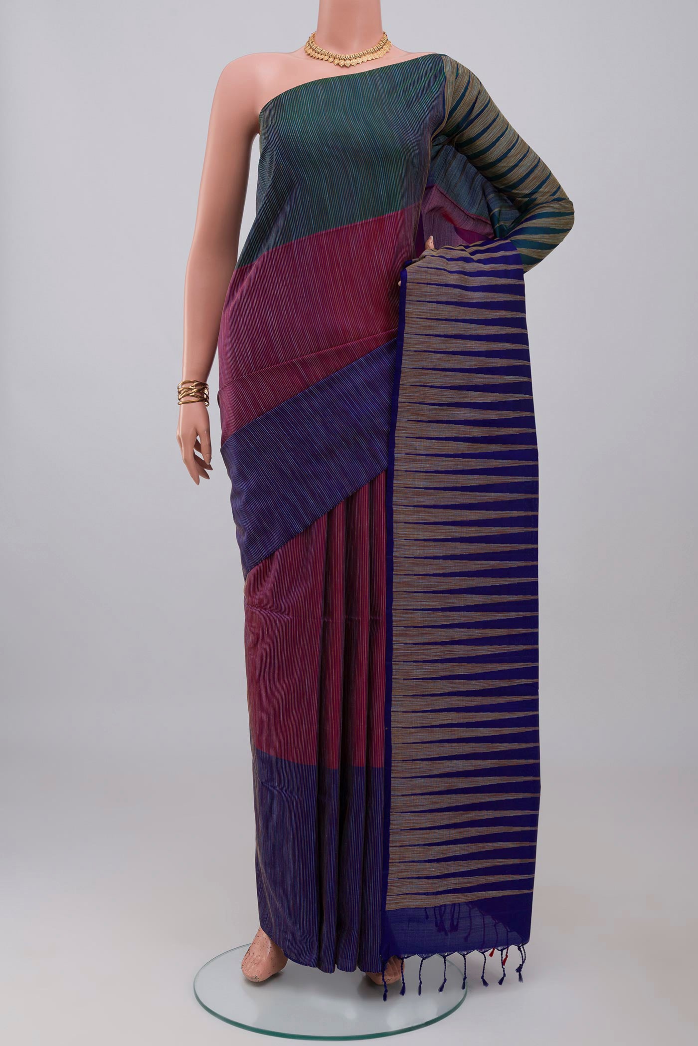 Multi Color Soft Silk Saree with Fancy on the body and Without Border.  displayed on a mannequin