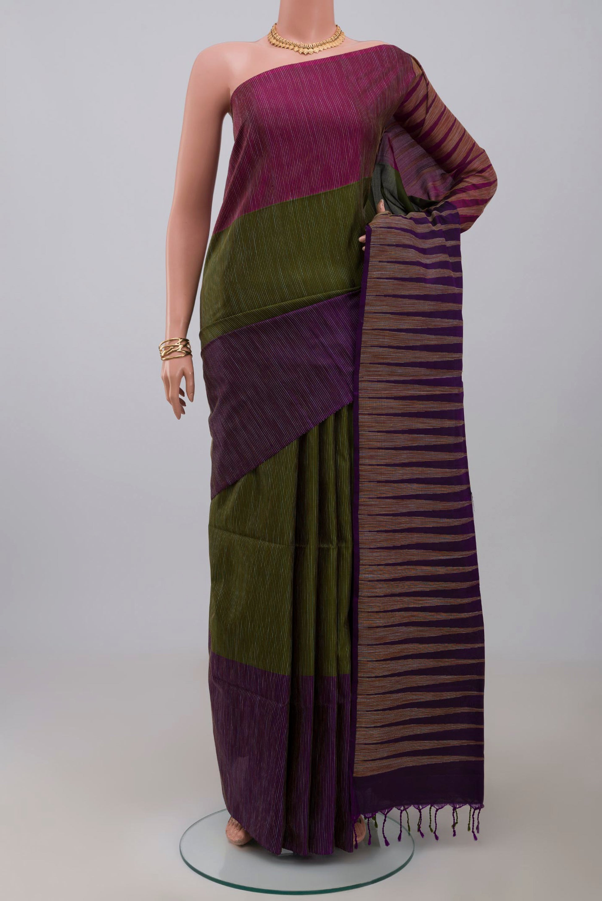 Green Soft Silk Saree with Plain Body and Ganga Jamuna Border.  displayed on a mannequin