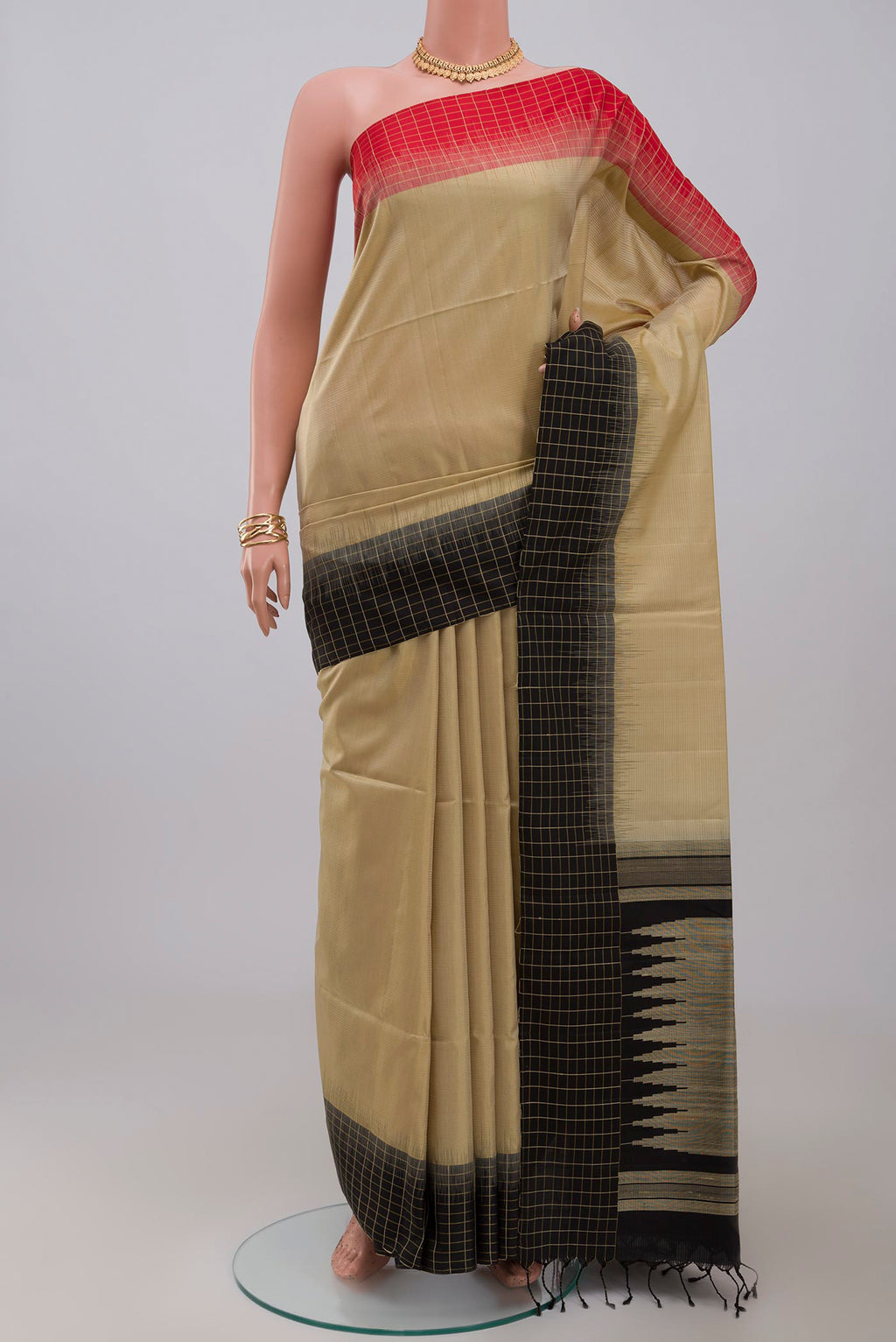 Cream Soft Silk Saree with Plain Body and Ganga Jamuna Border.  displayed on a mannequin