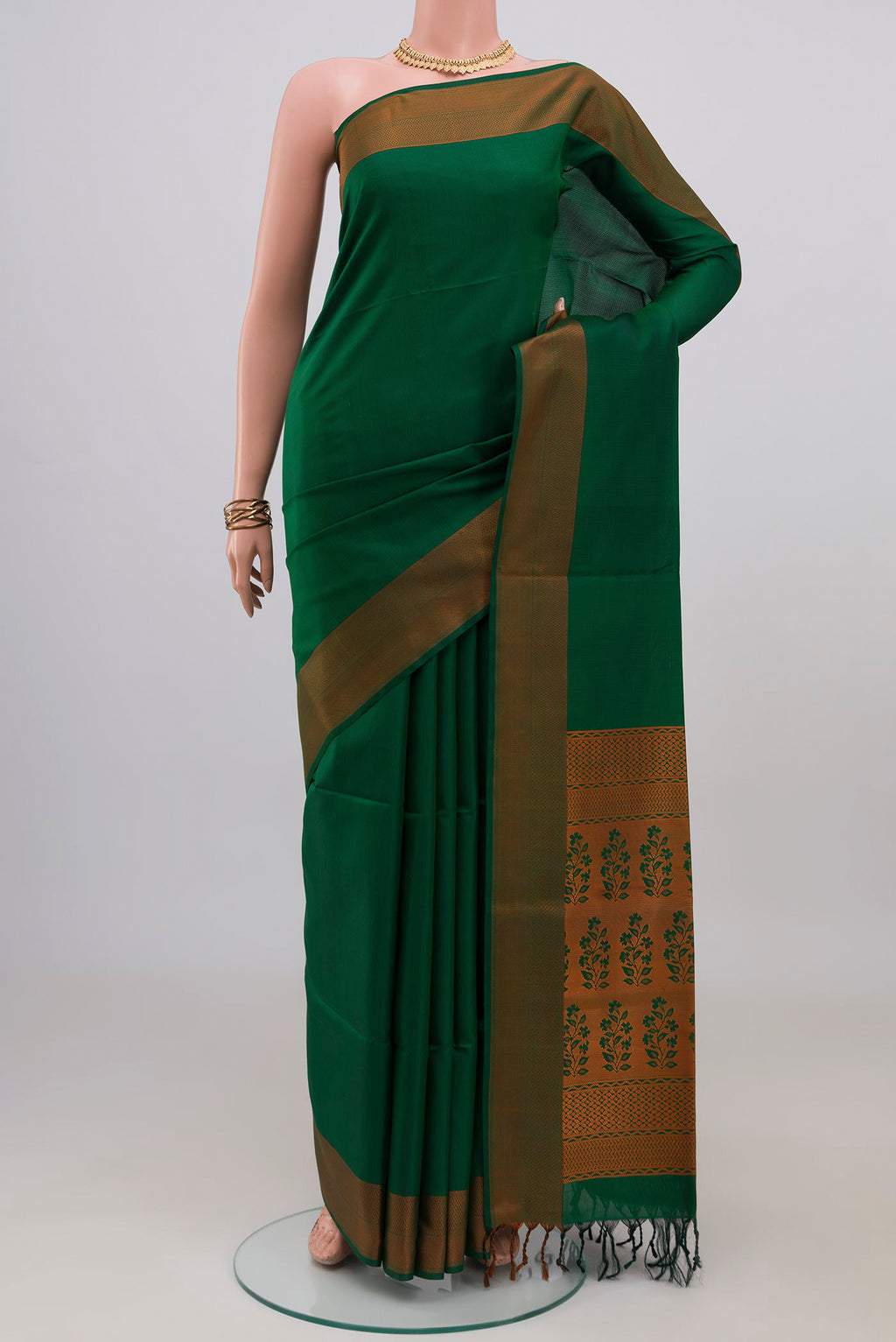 Green Soft Silk Saree with Jacquard design on the body and Thread Border.  displayed on a mannequin