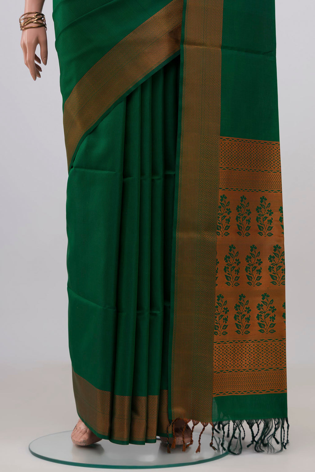 Pleats and pallu of Green Soft Silk Saree with Jacquard design on the body and Thread Border. 
