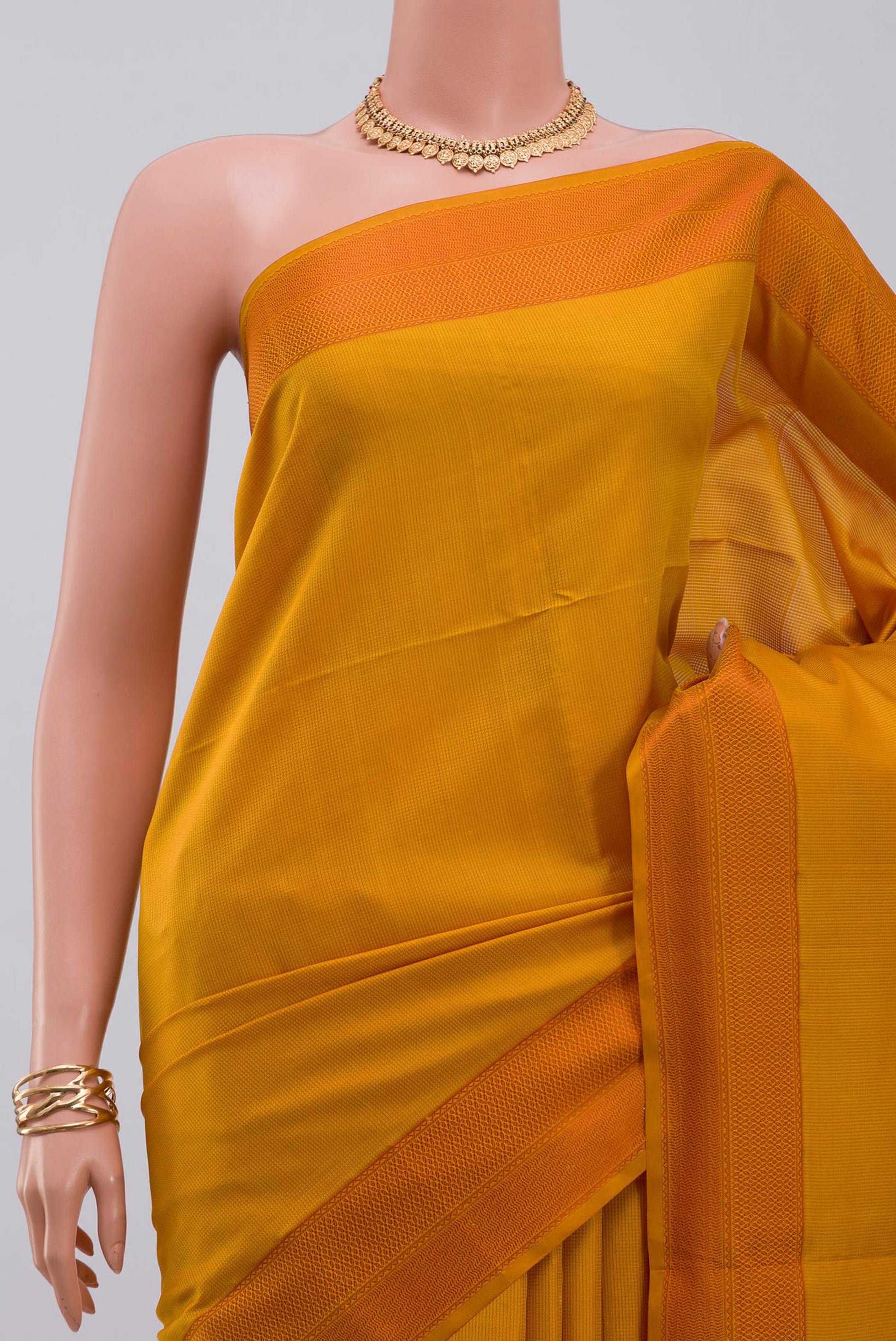 Border image of Yellow Soft Silk Saree with Checked design on the body and Thread Border. 