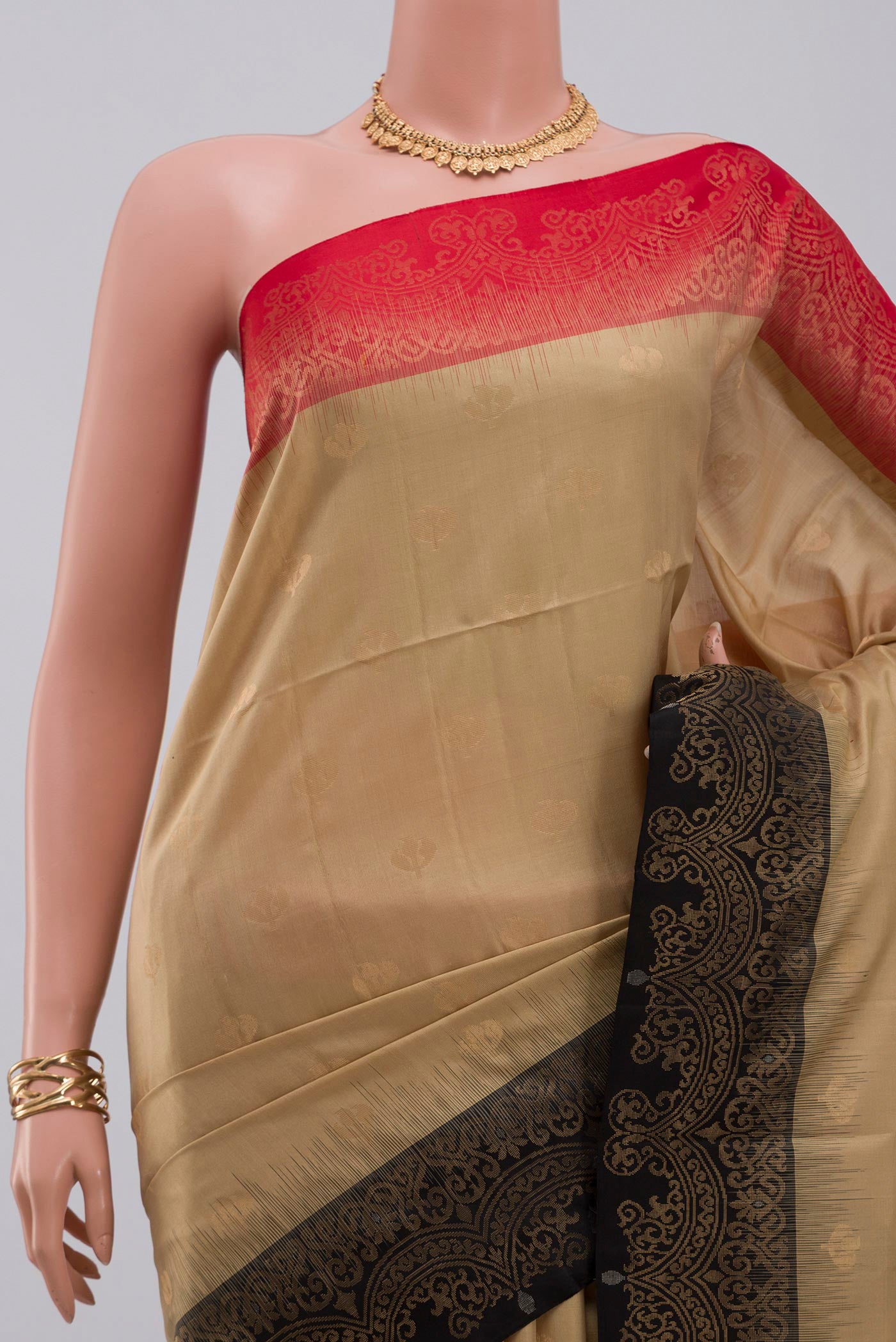 Border image of Beige Soft Silk Saree with Zari Butta on the body and Fancy Border. 
