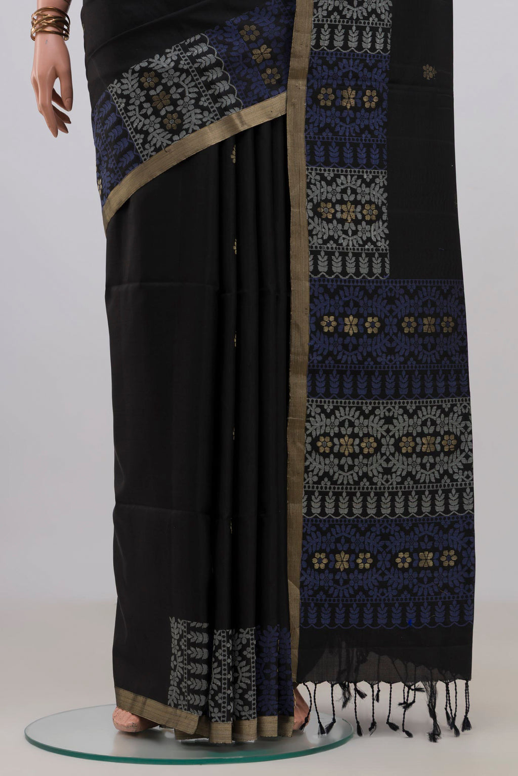 Pleats and pallu of Pure Silk Black Soft Saree with Zari Butta on the body and Fancy Border. 