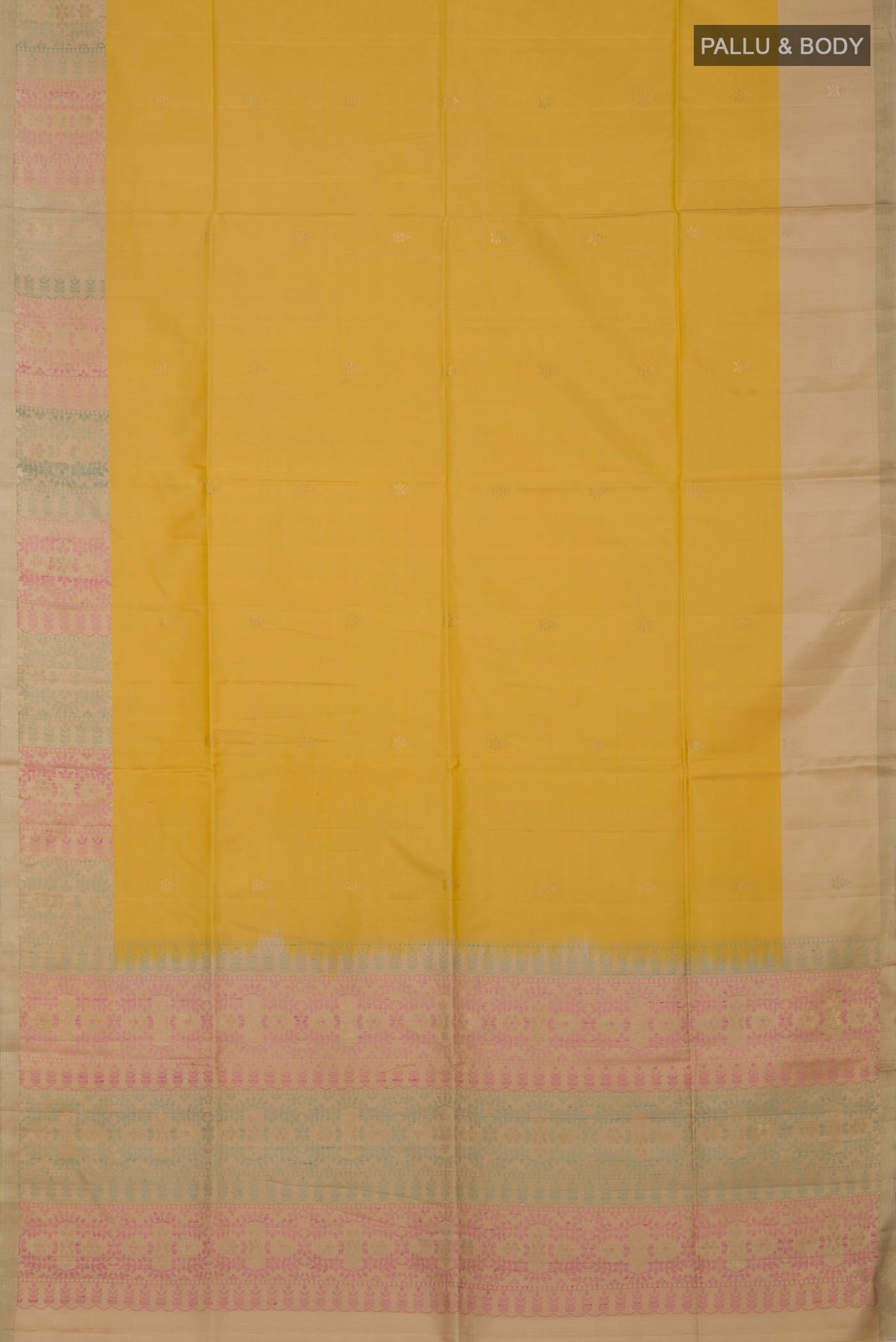 Flat view of Yellow Soft Silk Saree with Zari Butta on the body and Zari Border. 