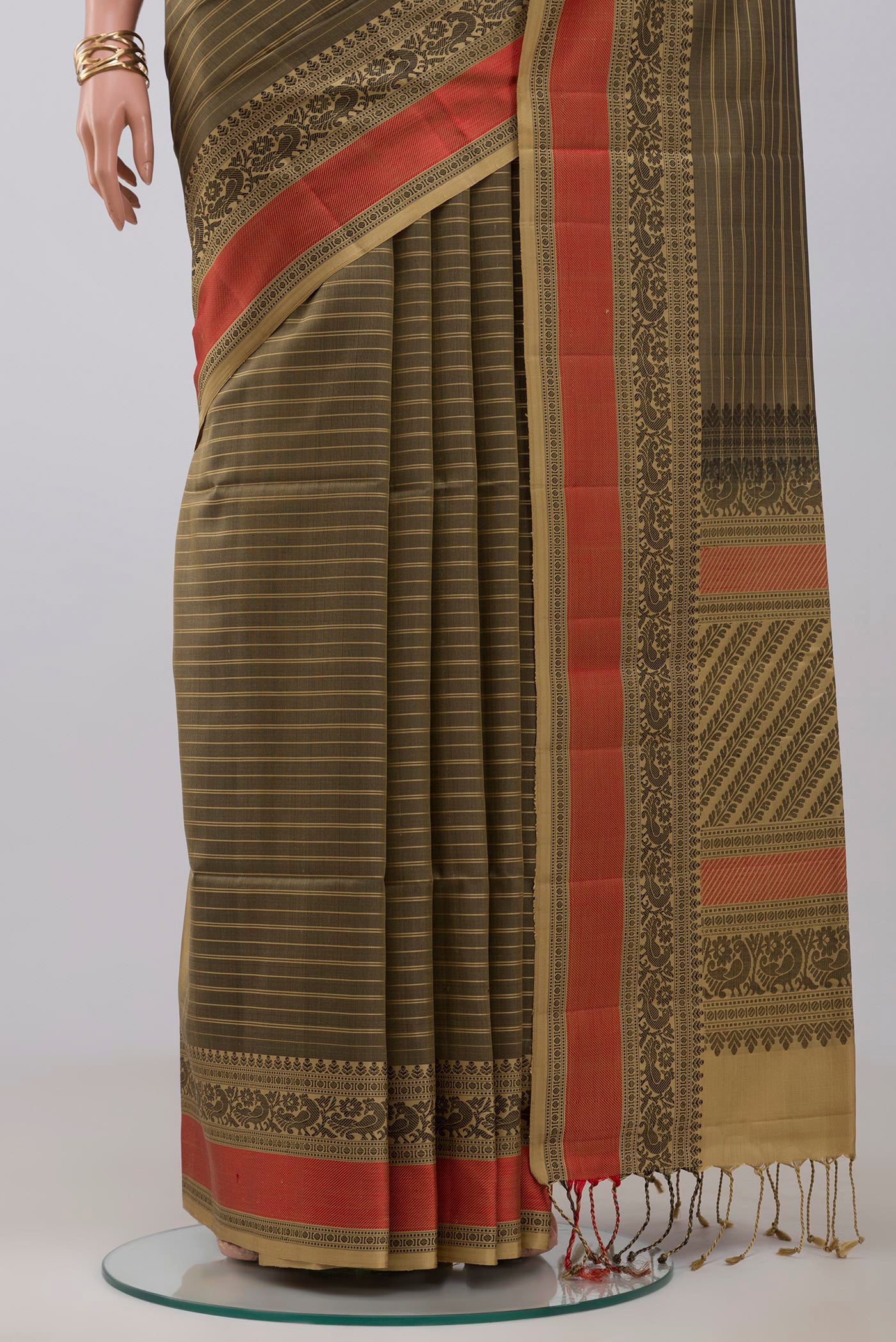 Pleats and pallu of Mehandi Green Soft Silk Saree with Stripes on the body and Thread Border. 