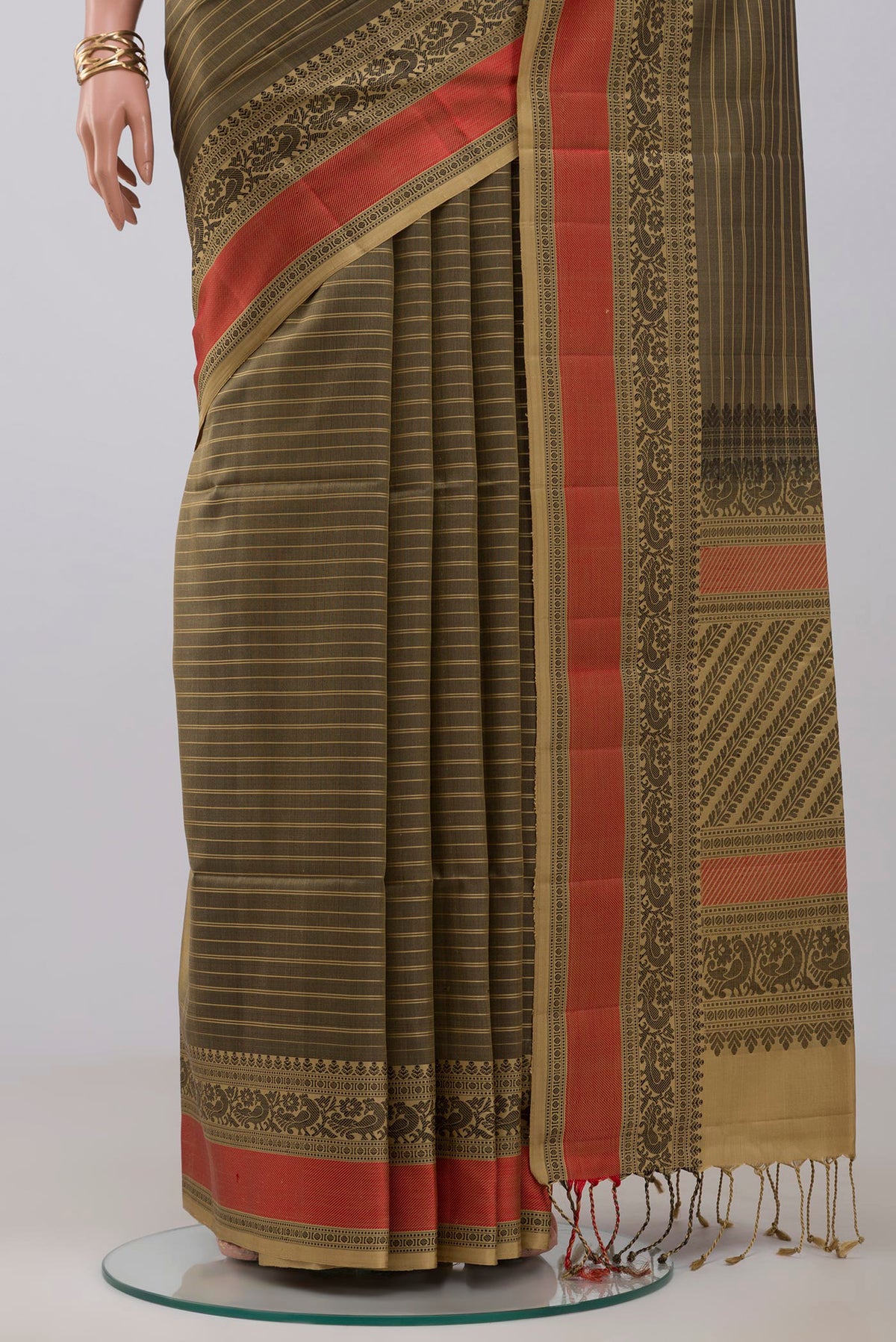 Pleats and pallu of Mehandi Green Soft Silk Saree with Stripes on the body and Thread Border. 