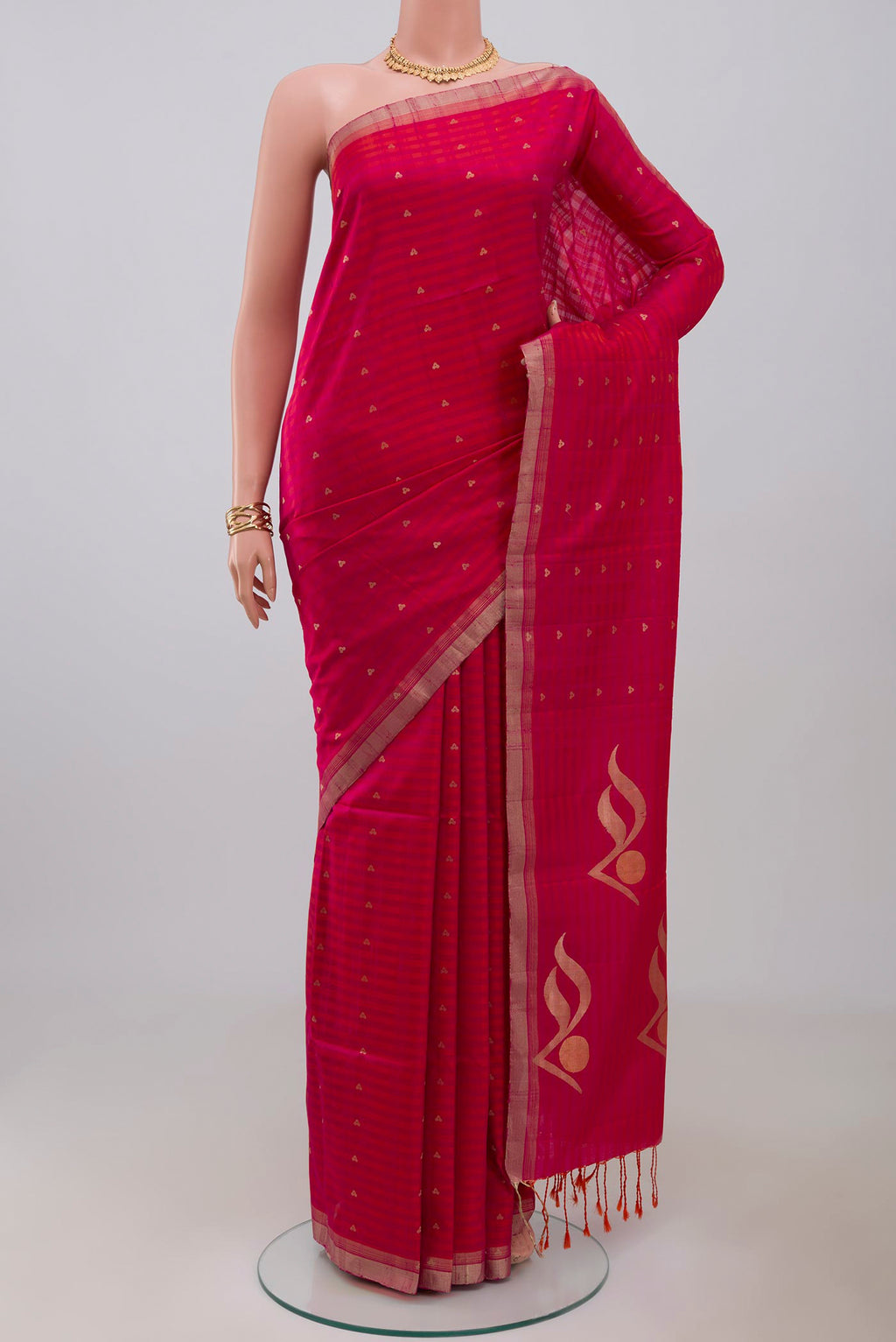Pink Soft Silk Saree with Zari Butta on the body and Thin Zari Line.  displayed on a mannequin