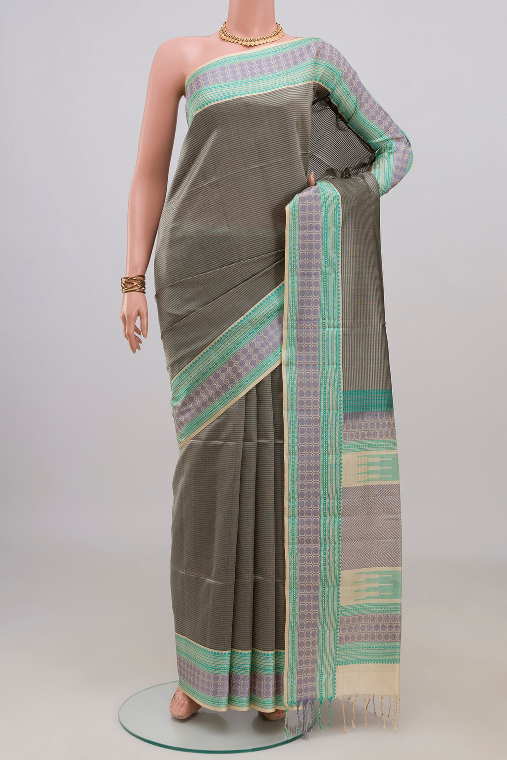 Pure Silk Grey Soft Saree with Stripes on the body and Thread Border.  displayed on a mannequin